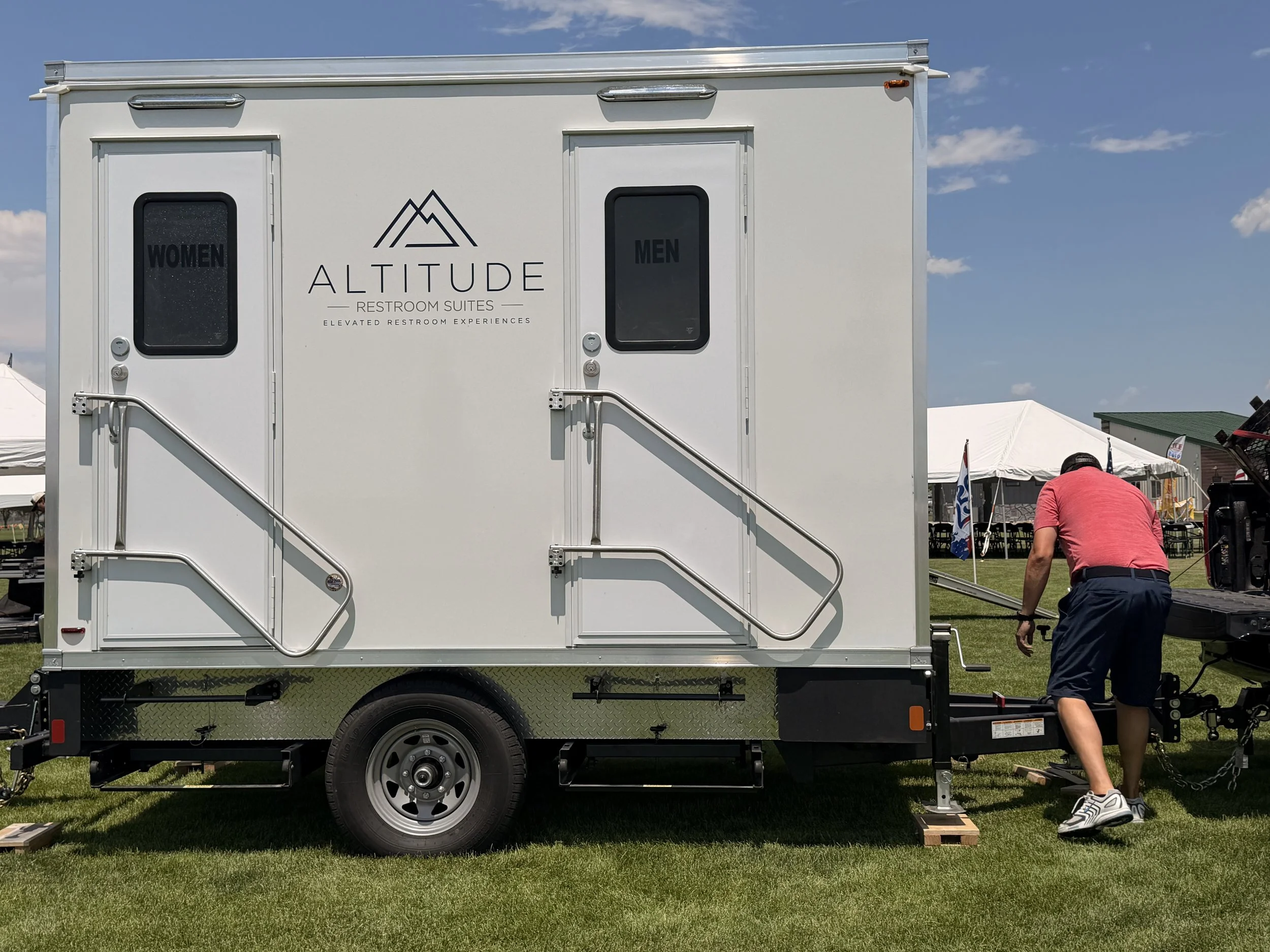 American-built Lang Specialty Trailers restroom trailer with private men's and women's entrances at a Colorado event