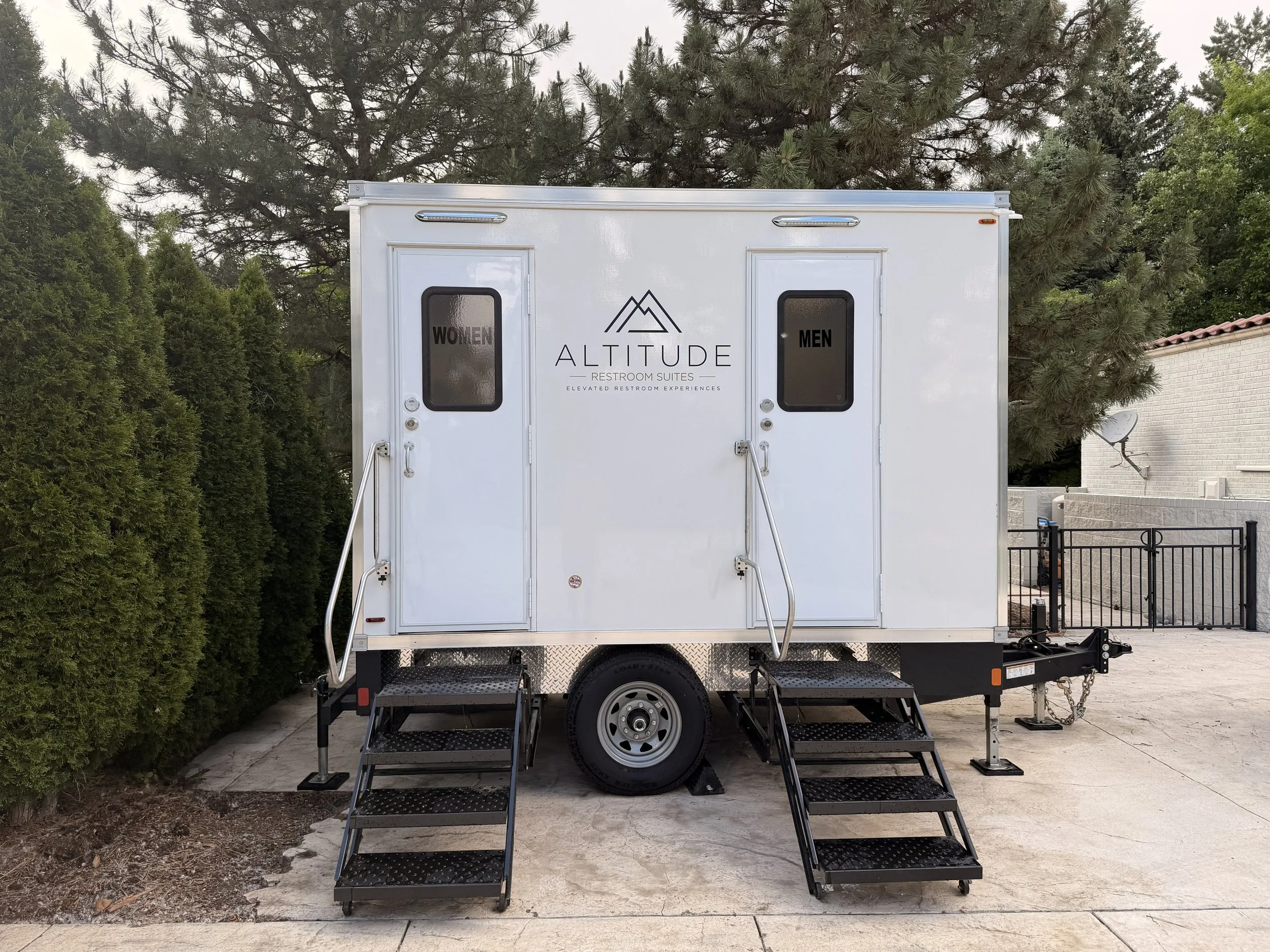 Luxury restroom trailer provided by Altitude Restroom Suites for a Colorado graduation party.