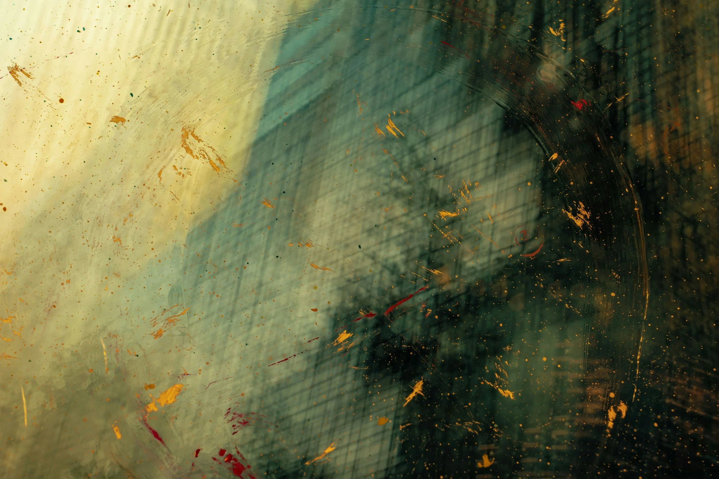 Close-up image of a dirty, scratched glass surface with greenish and yellowish streaks and smudges, partially obscuring the view of a dark background with faint grid pattern.