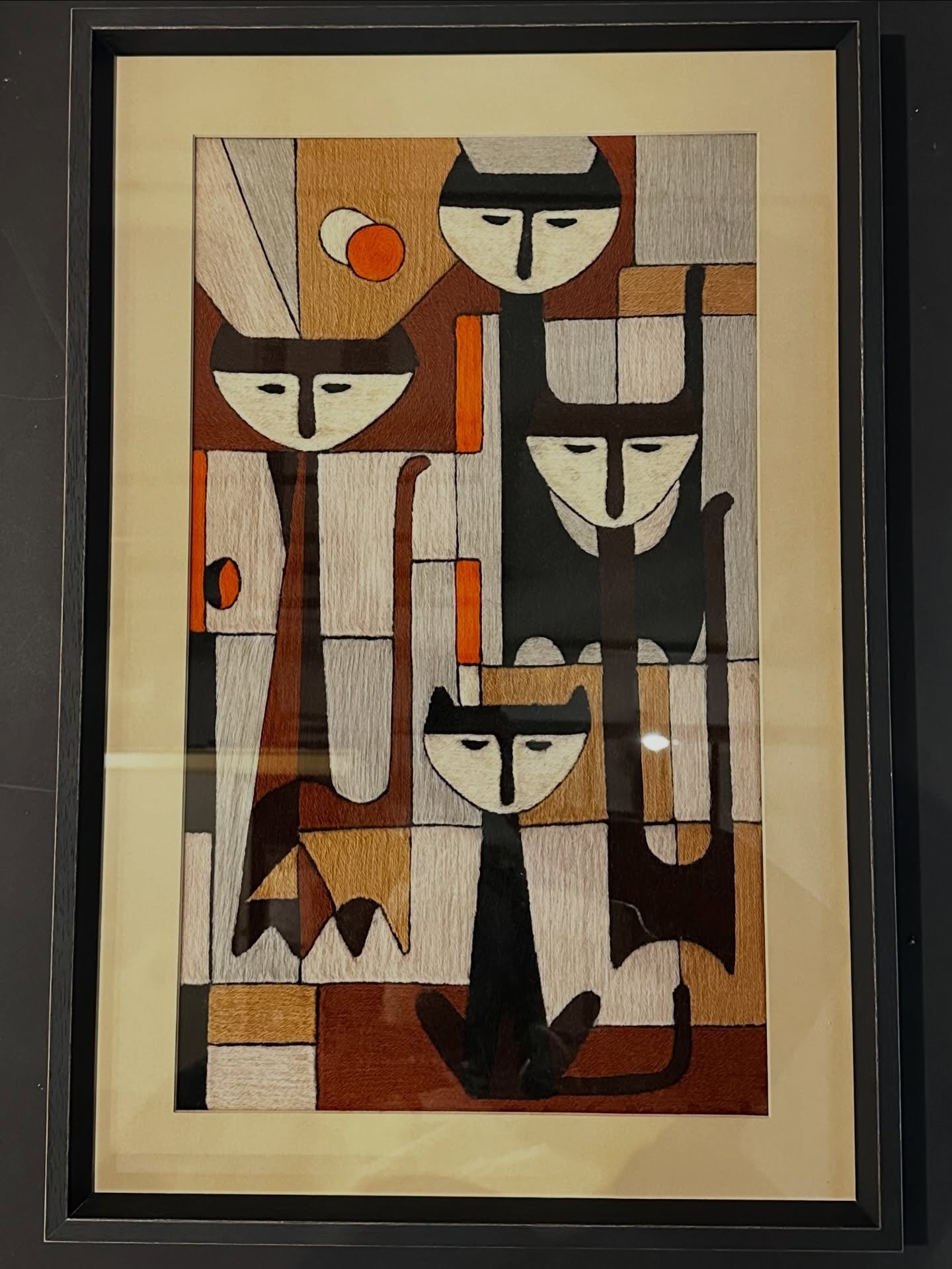 cool cats. 

textile art in a charcoal frame with cotton rag matting. 

designed by gray, framed by joey