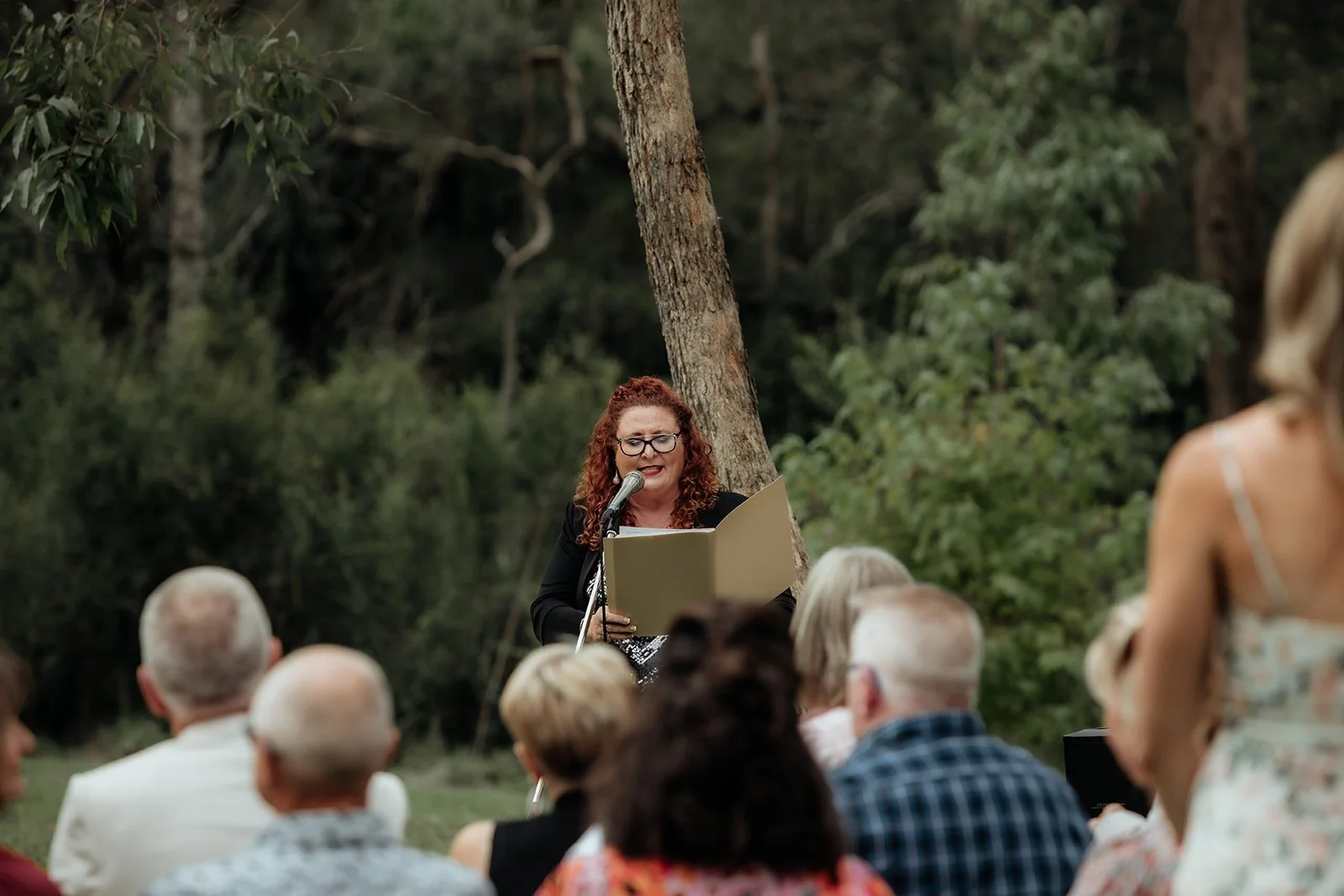 Kate Ellis, Brisbane celebrant, performing heartfelt funeral service in a garden — approachable, professional and genuine