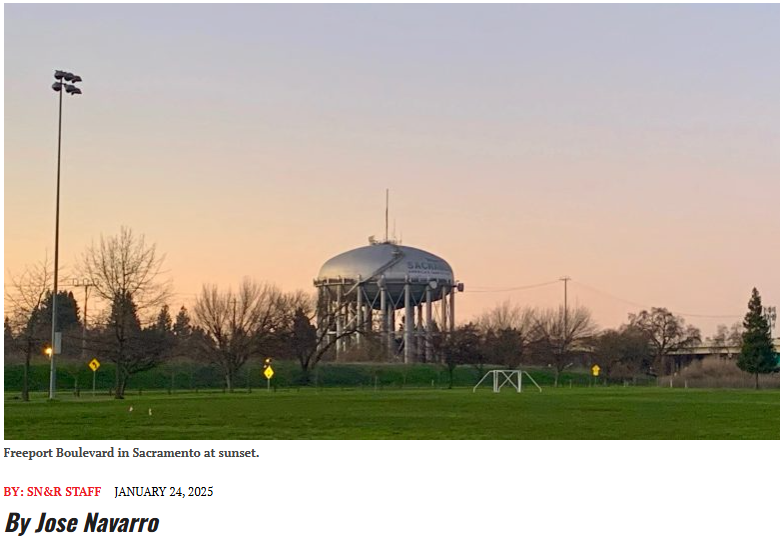 A large spherical water tower with the word "Sacramento" on it, situated among trees and a sports field at sunset.