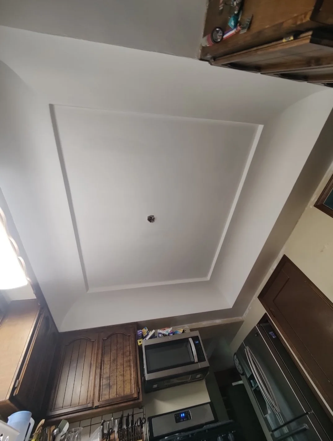Crown molding ceiling replaced after water damage