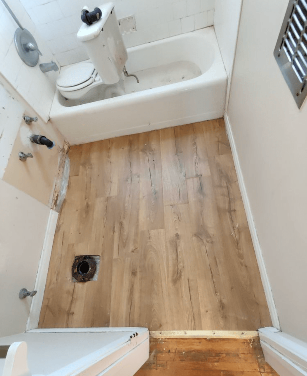 Bathroom water damage. Pipe leak. Repair and file insurance claim.