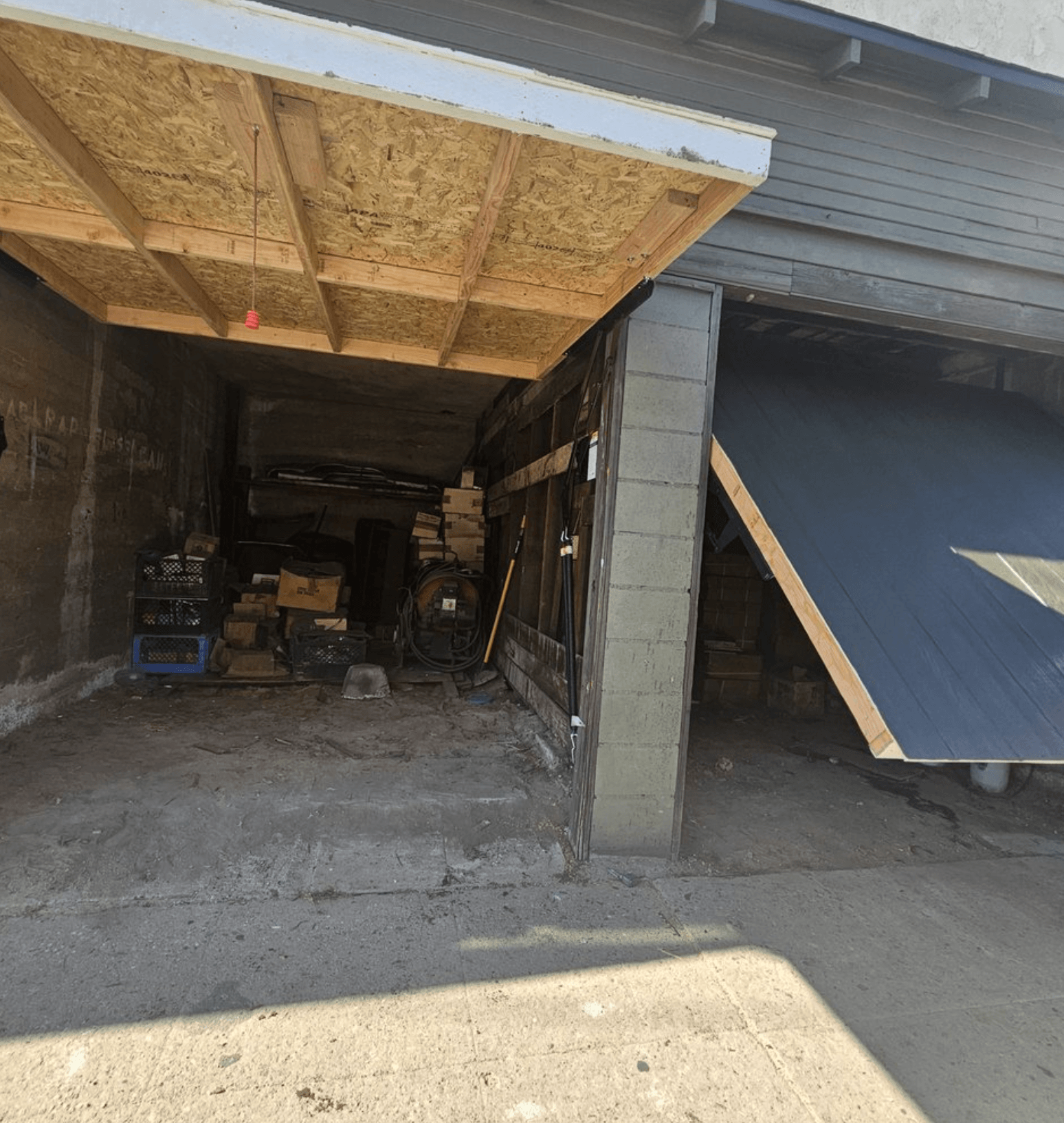 Opening and closing new custom solid wood garage doors.