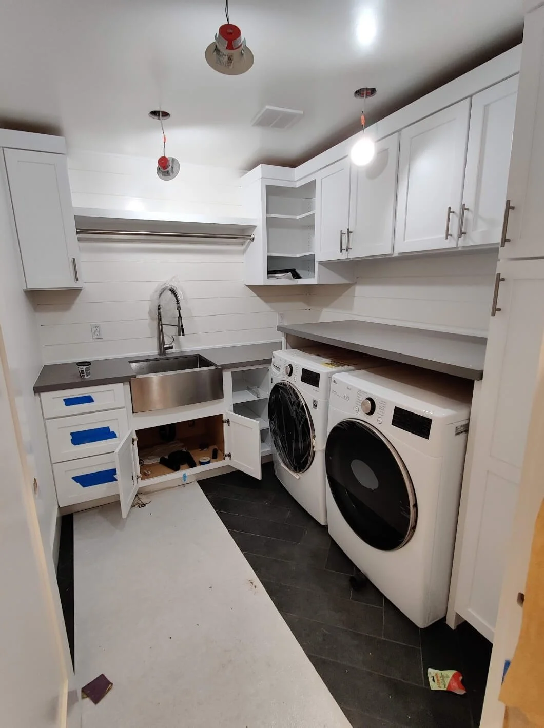 Custom laundry upgrade. Walk in with large counter space