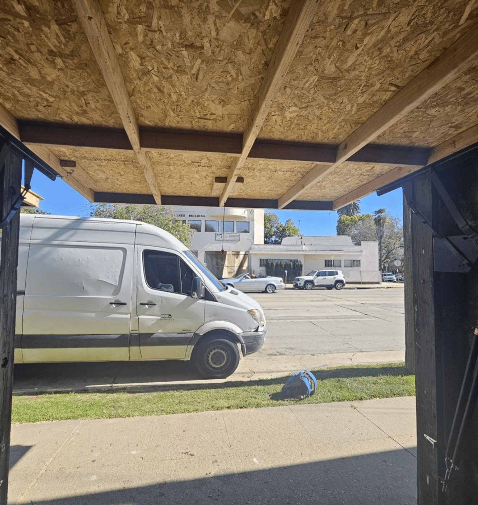 Built strong reinforced custom sized solid wood garage door.