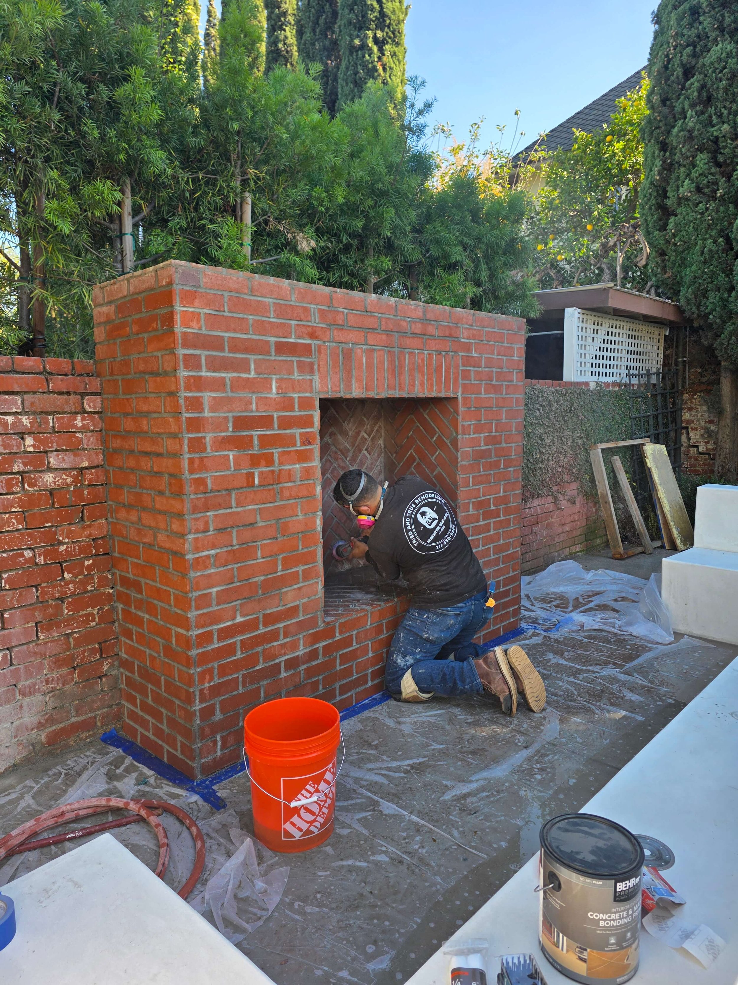 Restoring outdoor brick fireplace. New grout. new gas line.