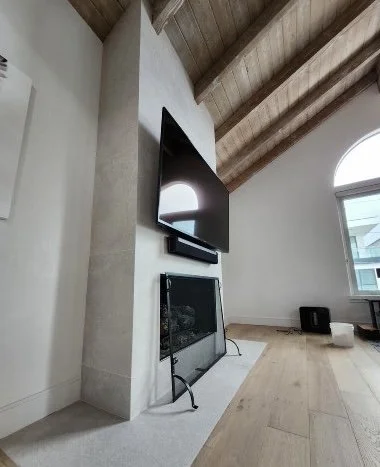 Upgrade office space with large mounted tv and updated fireplace. wood exposed rafters