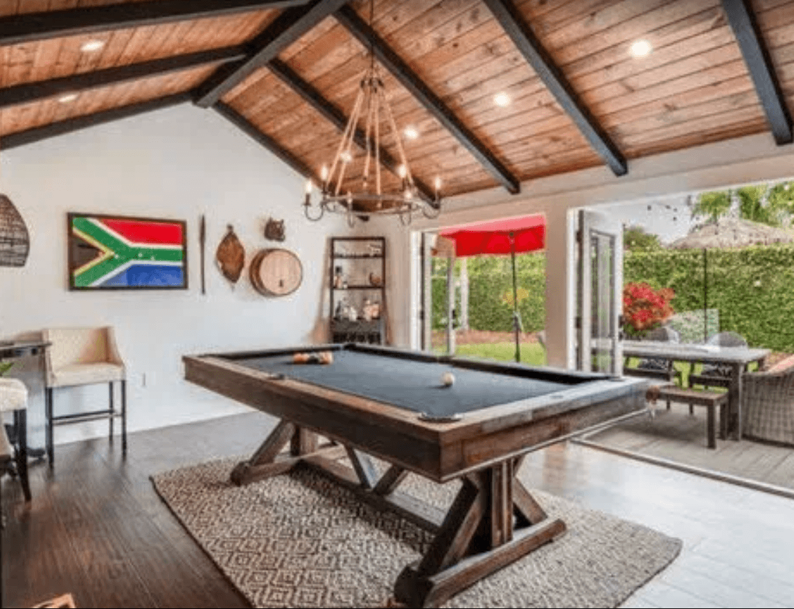 Man cave enclosed patio.Large windows. French doors.