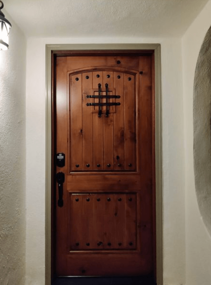 Replaced old wood door on Spanish style home with new solid wood Mediterranean style door and hardware