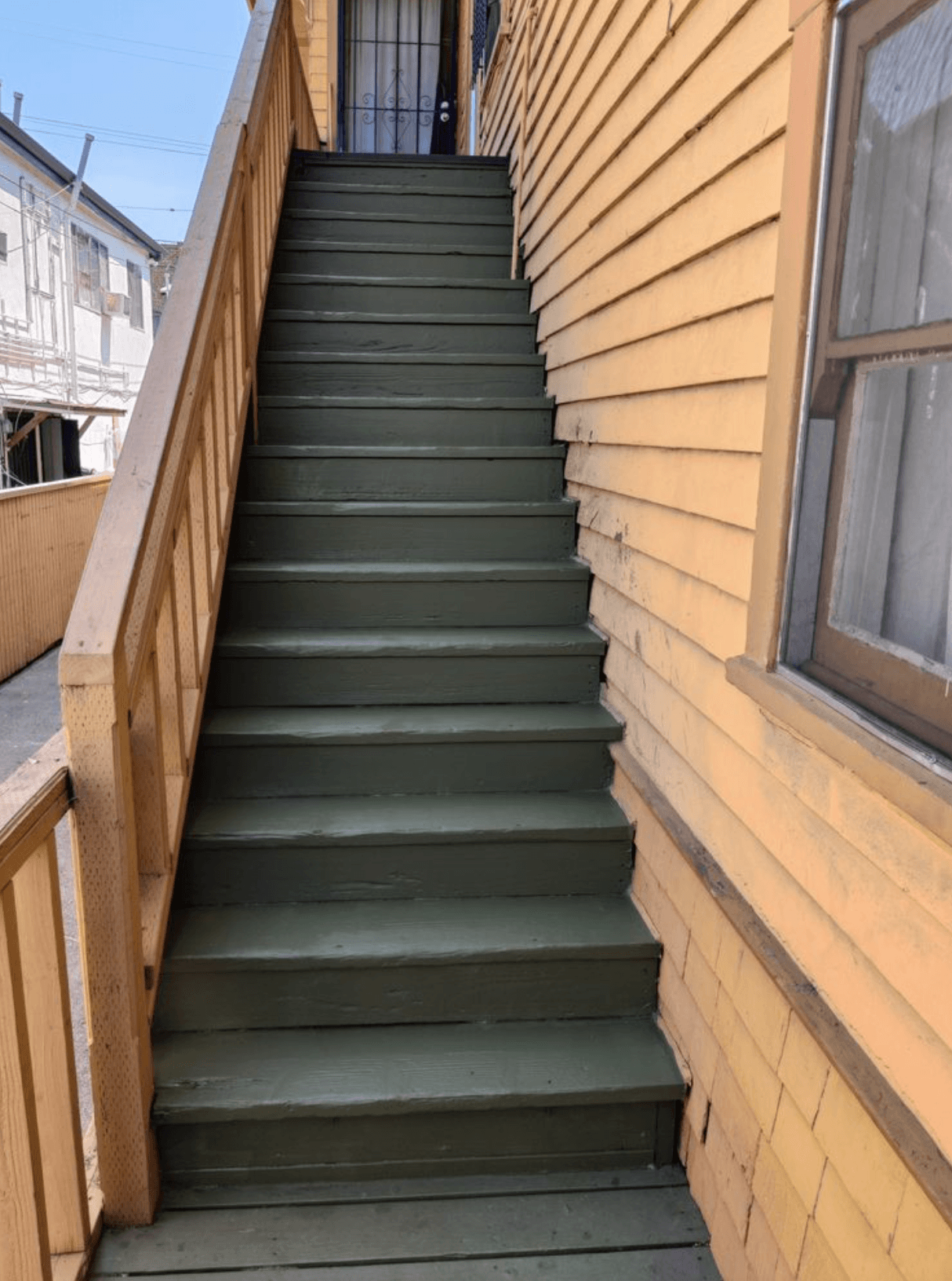 Refinish and repaint exterior wood stairs and risers