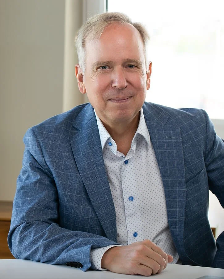 Image of Dr. Marty Ross sitting as his desk at the clinic for functional medicine and lyme disease.
