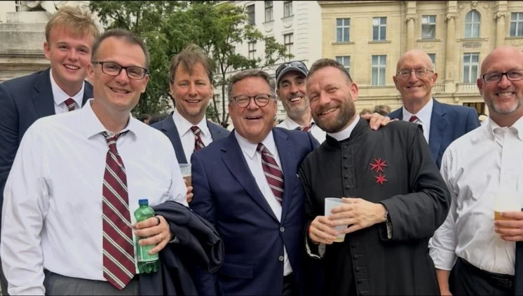Group of Mastersingers after Mass along with the priest joining in the after service festivities. 