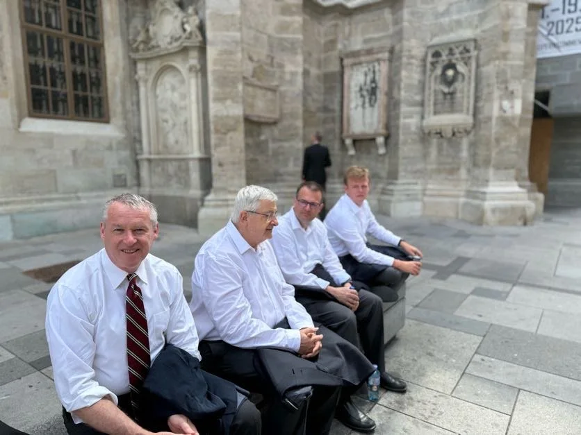 Four Mastersingers waiting outside the cathedral before Mass