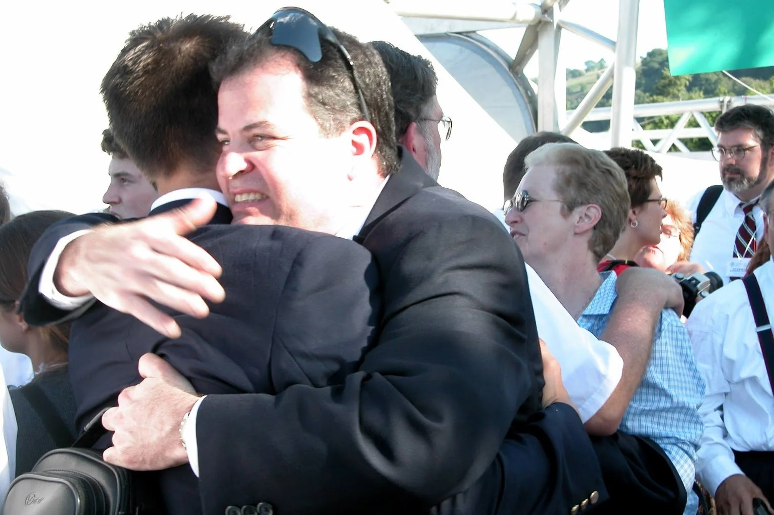 People hugging at a gathering