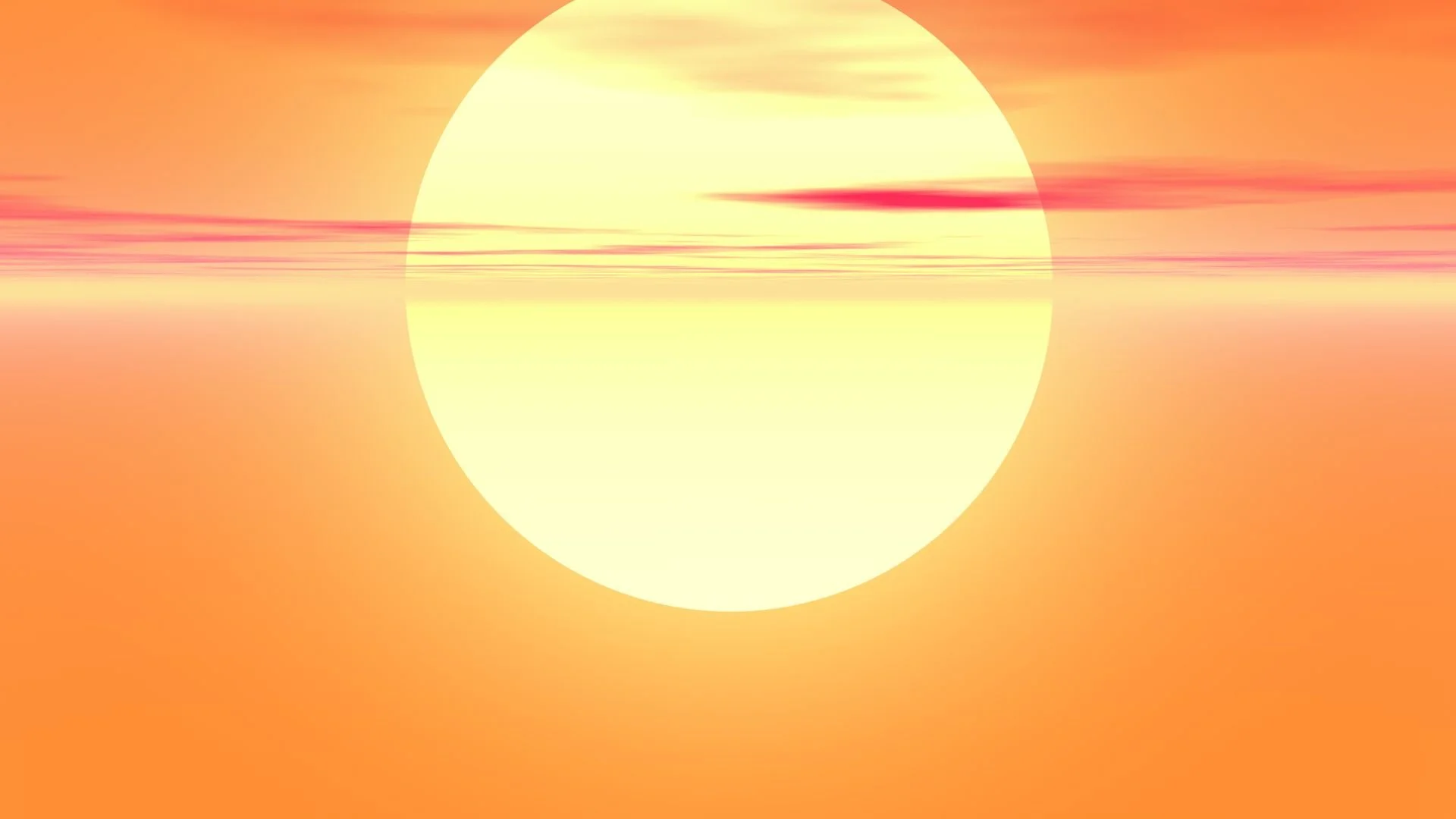 Un tramonto con il sole visibile sopra l'orizzonte, con sfumature di arancione e giallo, e alcune nuvole leggere.