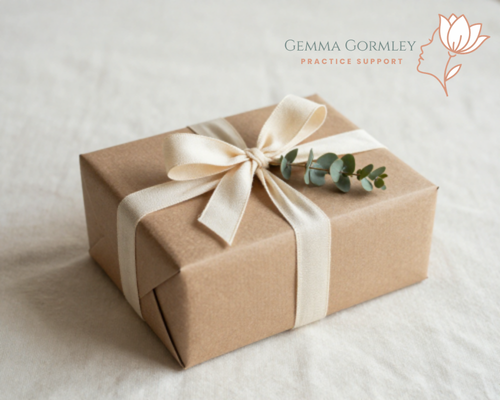 A gift box wrapped in brown paper with a cream-colored ribbon and a small green plant, placed on a white surface with a logo and the text 'Gemma Gormley Practice Support' in the top right corner.