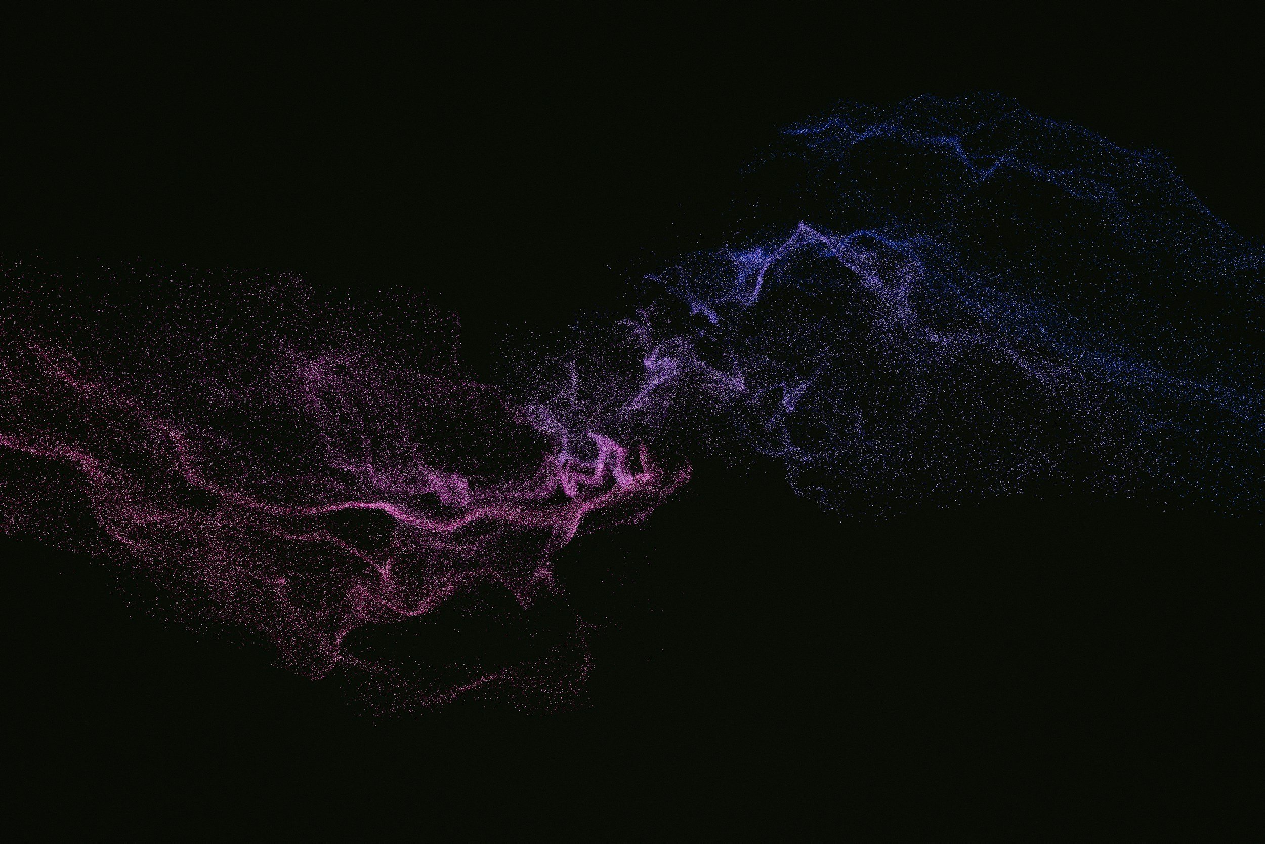 Digital art featuring swirling lines of pink and blue particles on a black background.