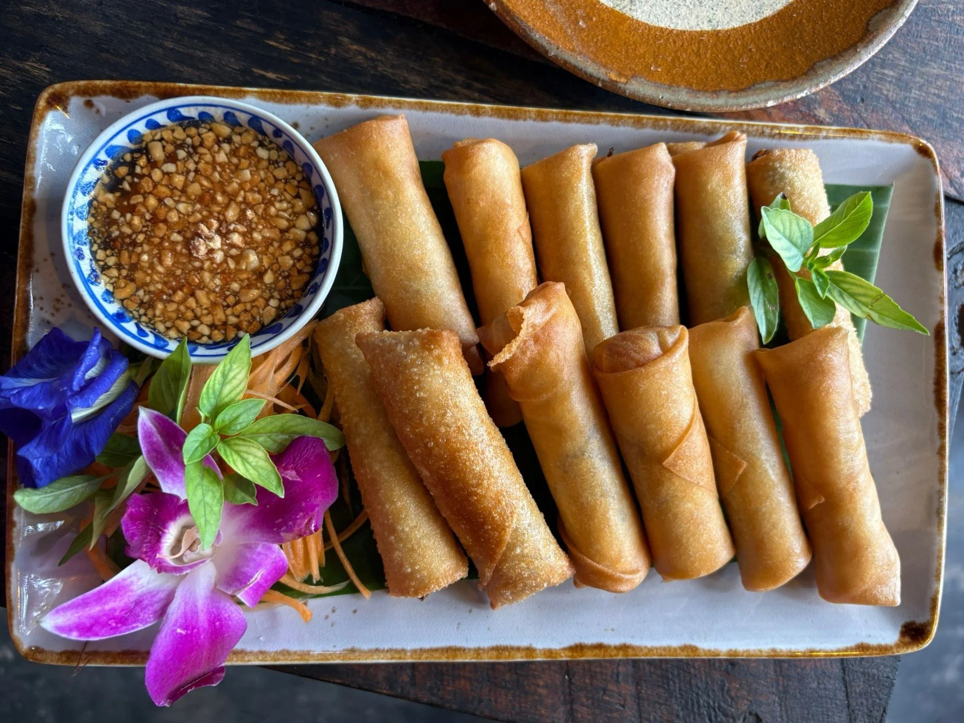 Thai spring rolls with peanut dipping sauce, made in a Proud Home cooking class