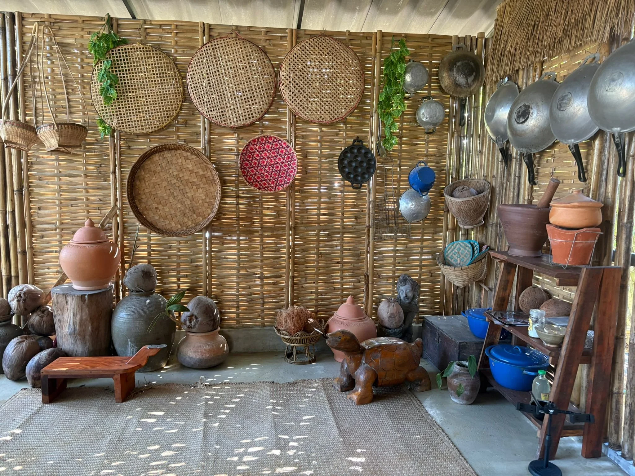 Traditional Thai cookware, baskets and clay pots in the Proud Home kitchen on Koh Phangan