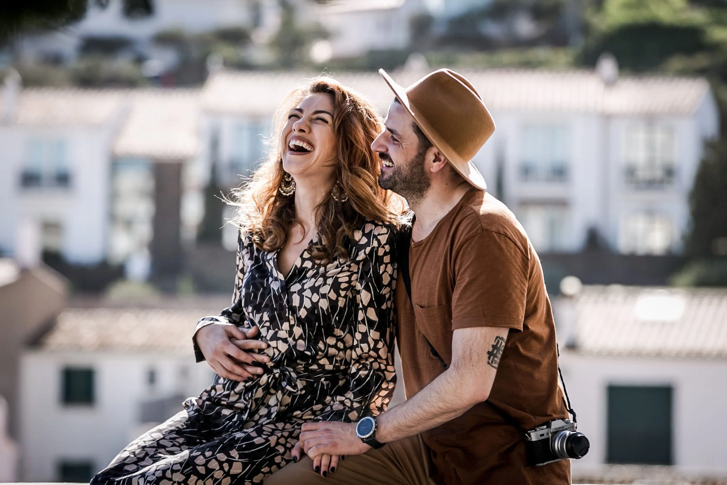 couple laughing and celebrating their love during a photosession in cadaques, costa brava
