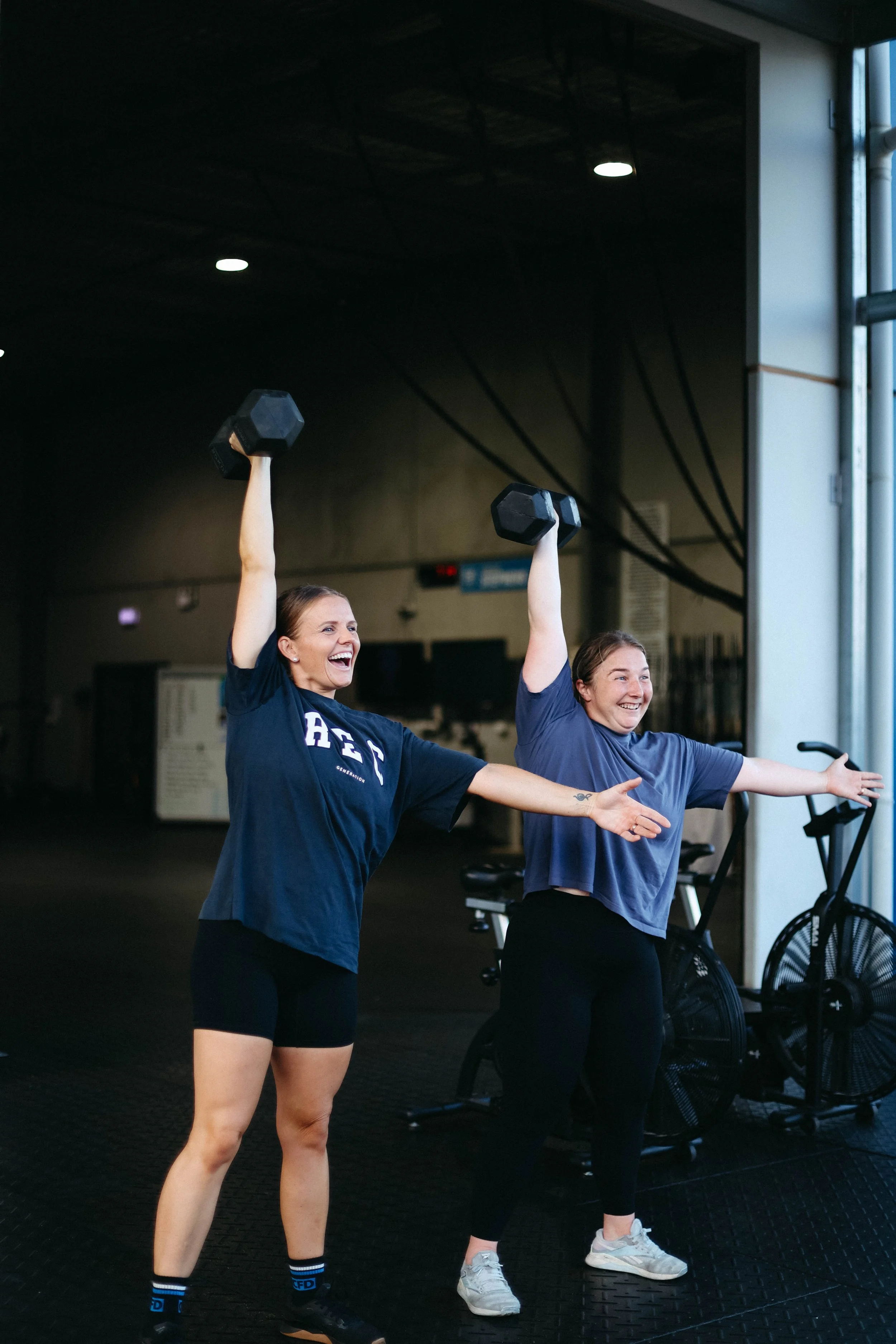 Beth and Katelyn doing a dumbell snatch