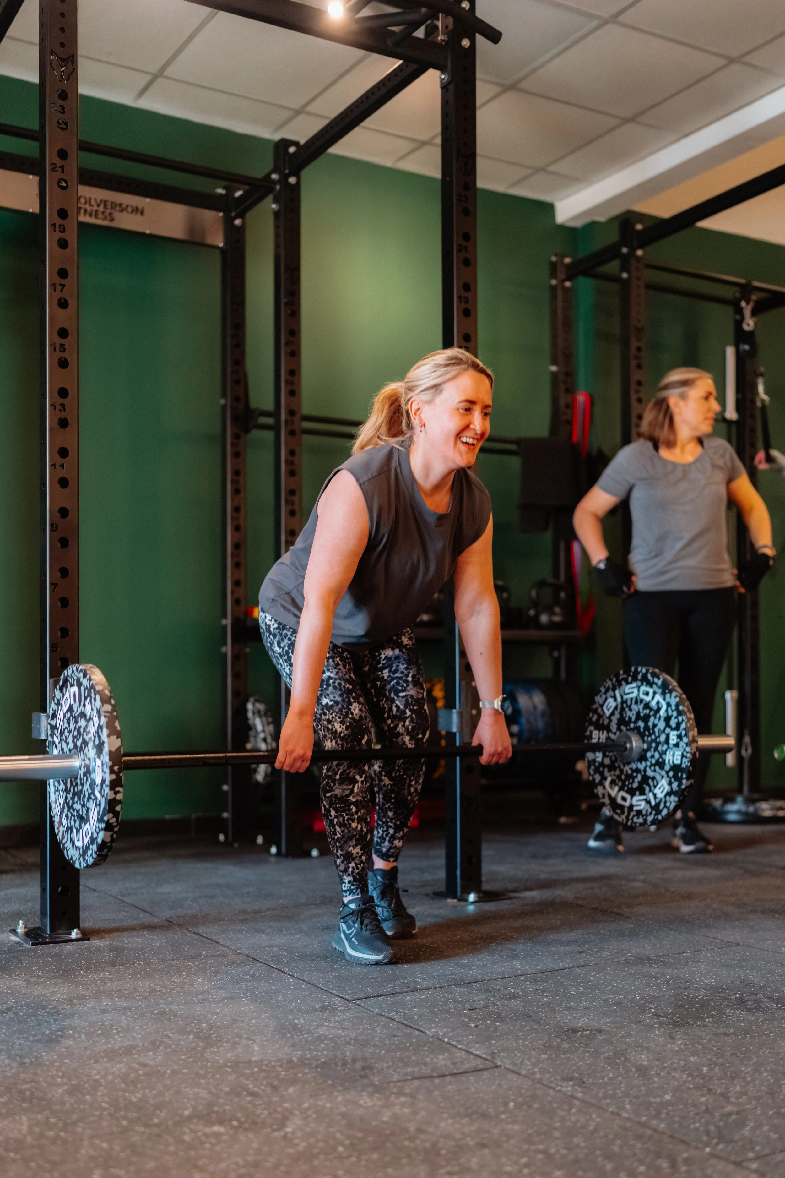 Women lifting laughing