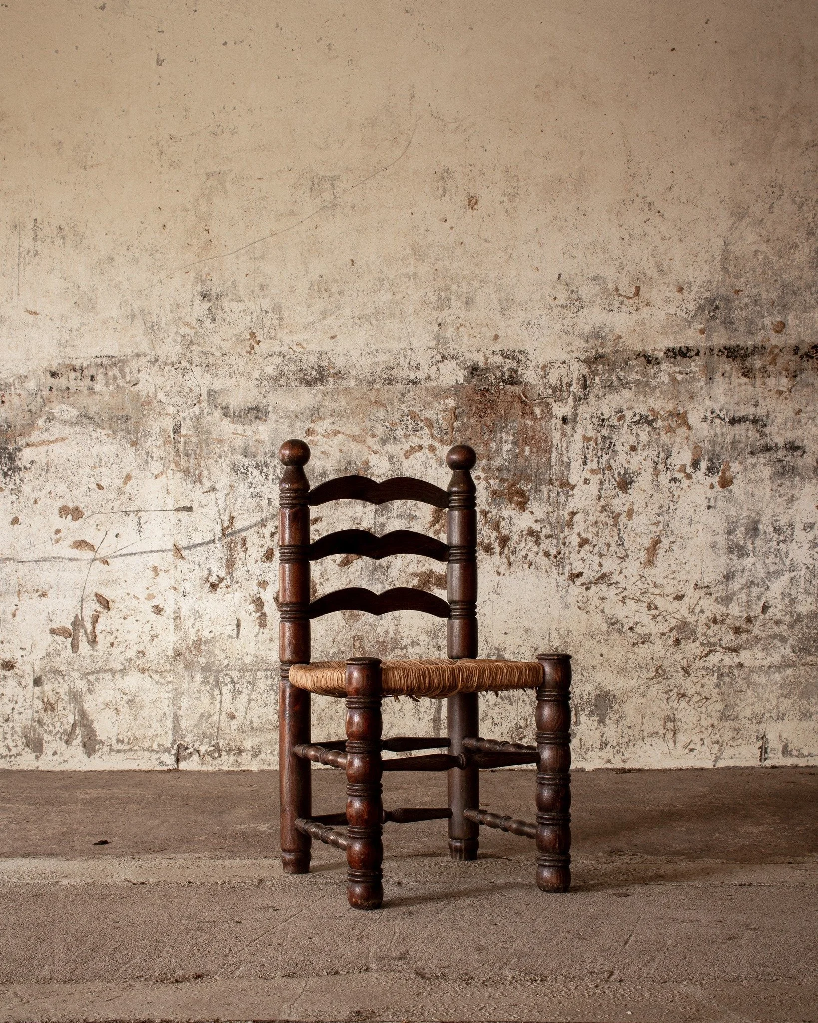 A set of 7 chairs with frames of sandblasted and stained pine and seats of wicker.

Price on request