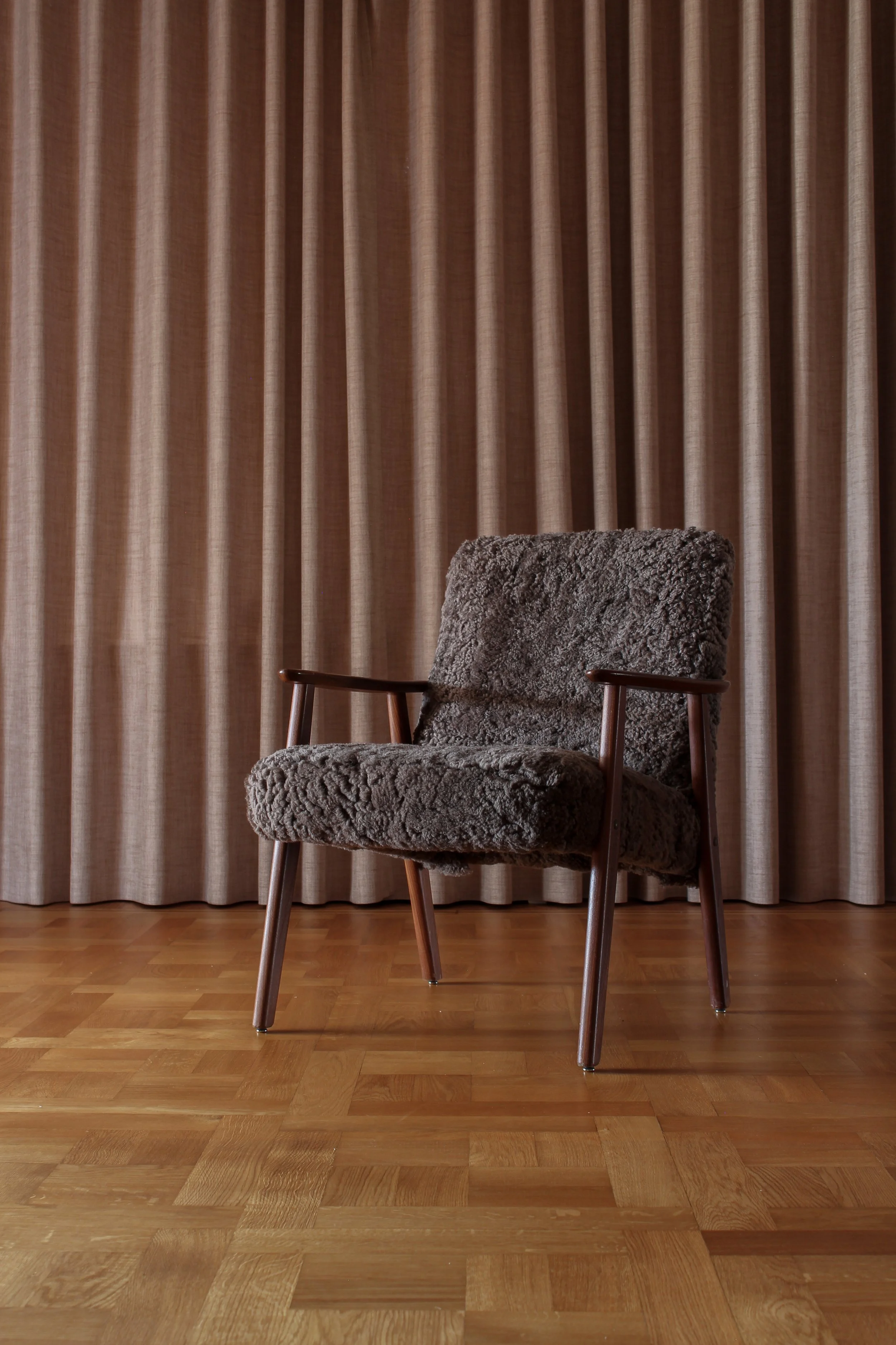 Lounge chair refurbished with brown lamb wool