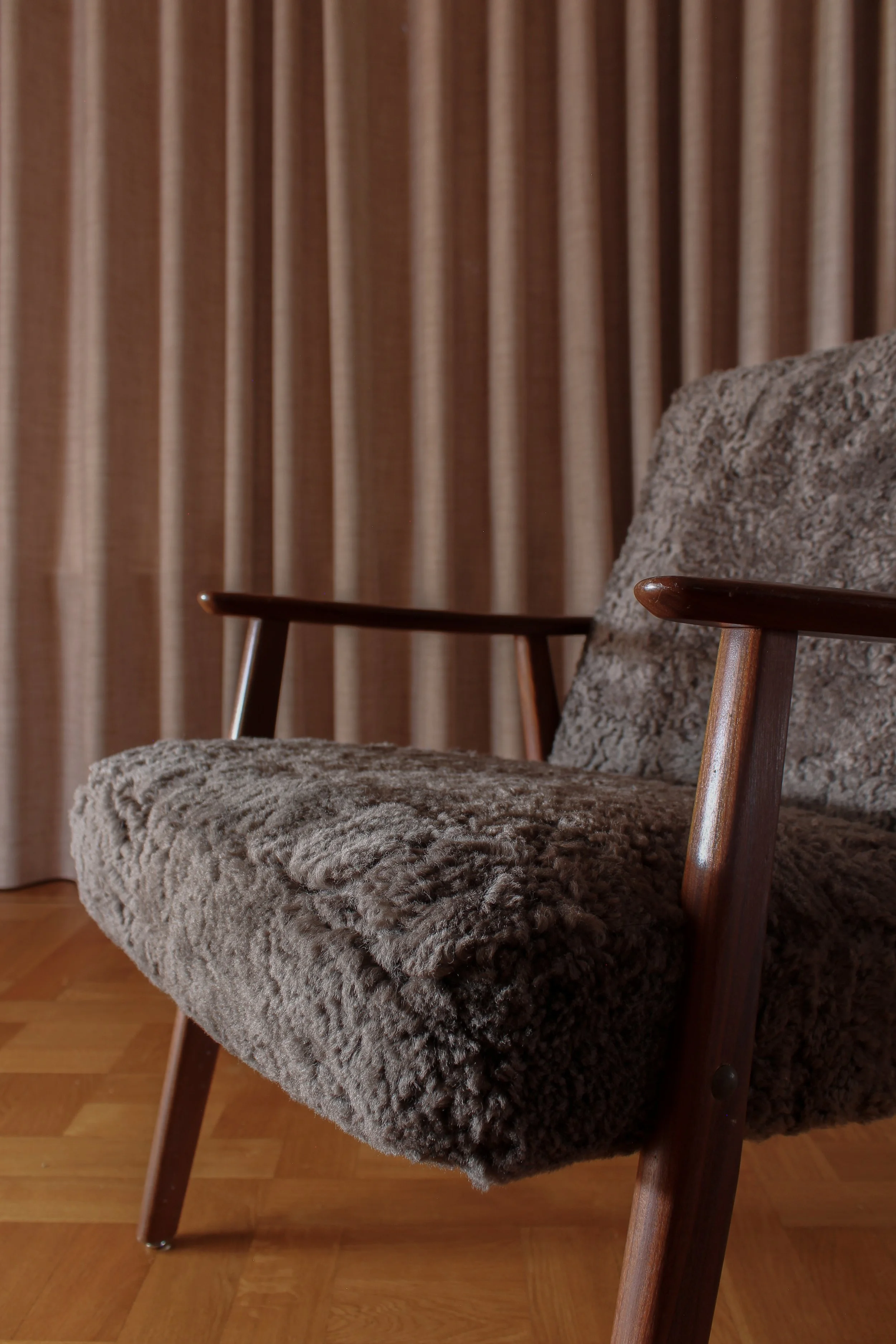 Lounge chair refurbished with brown lamb wool
