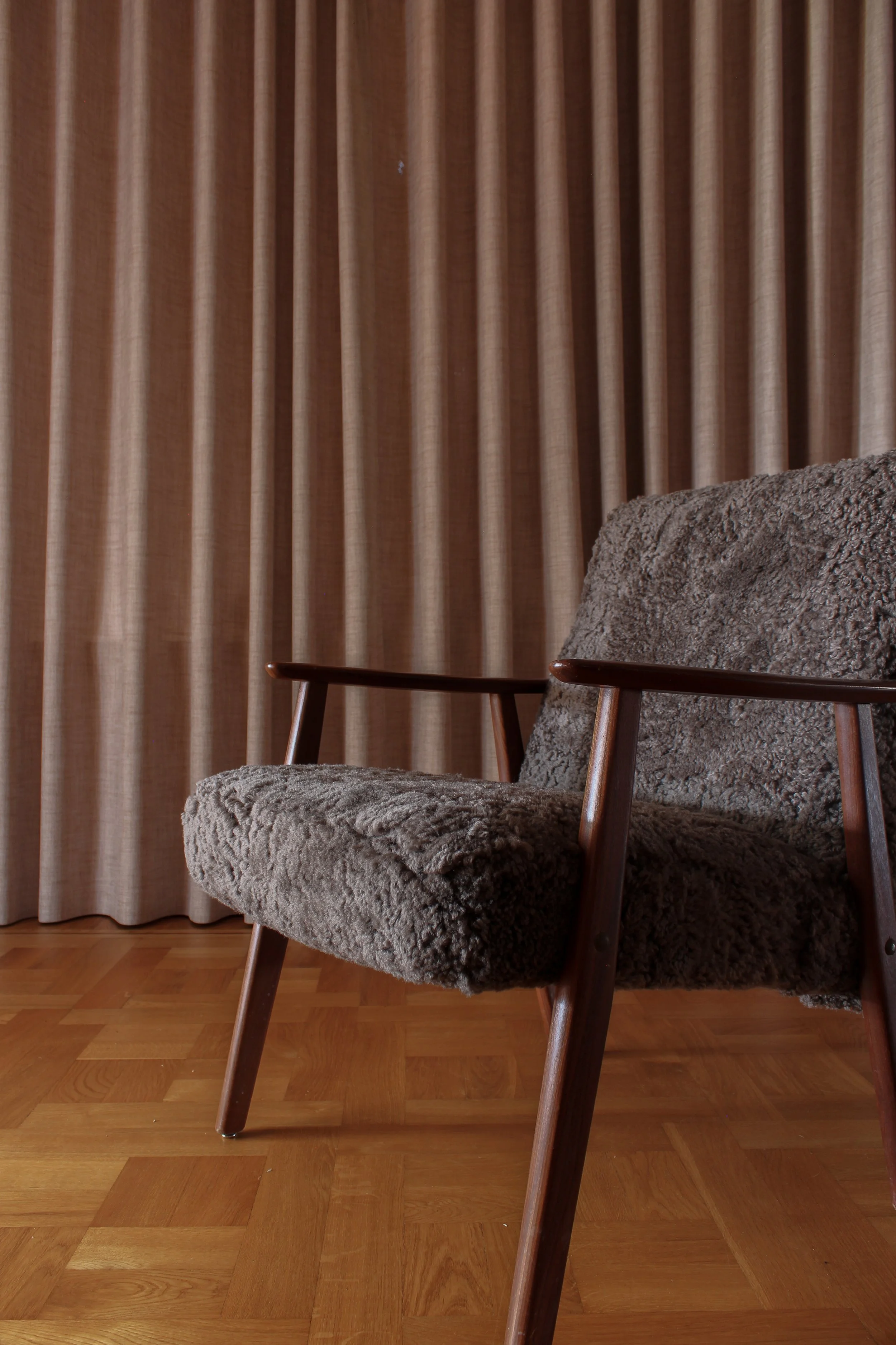 Lounge chair refurbished with brown lamb wool