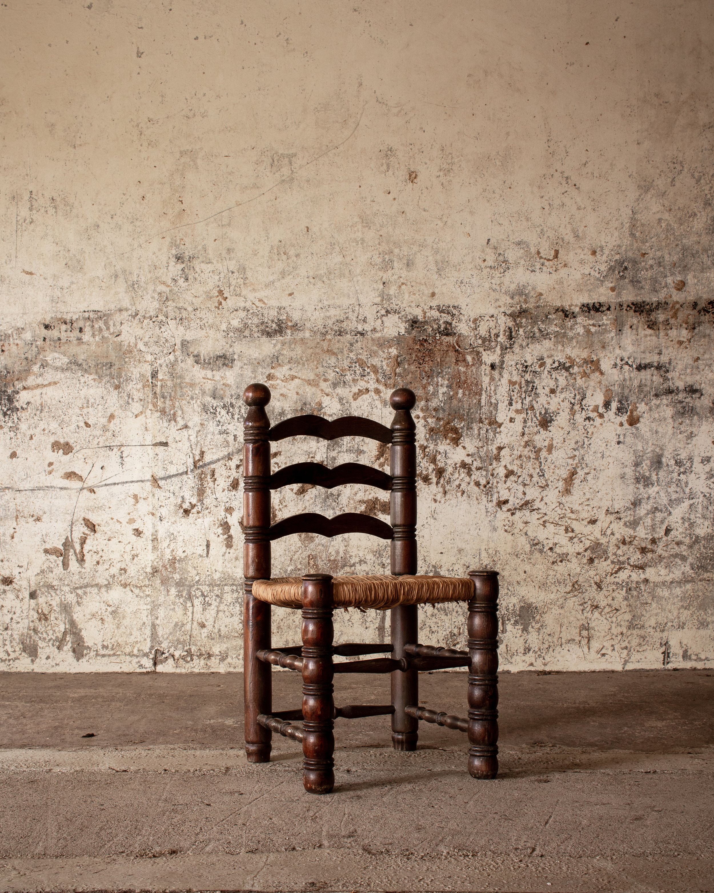 A set of 7 french ladderback chairs