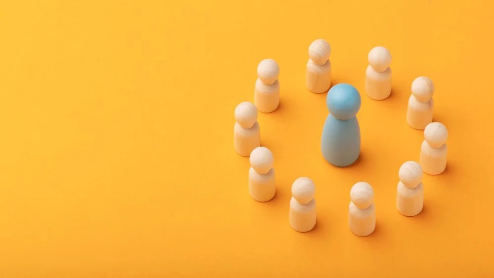 wooden figures representing Defining Leadership Development