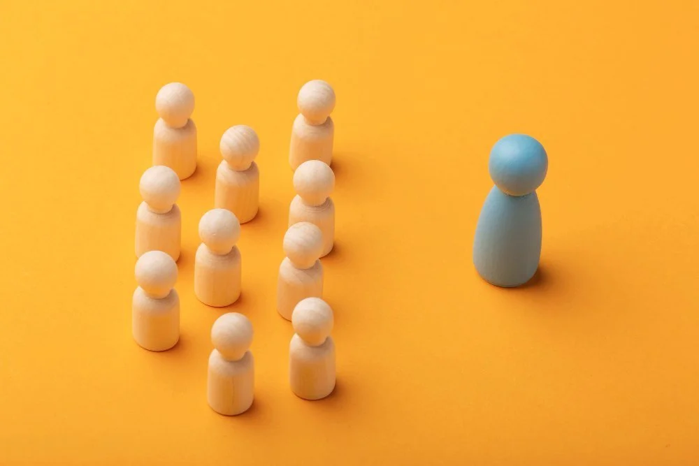 wooden figures representing Leadership Development in the 21st Century