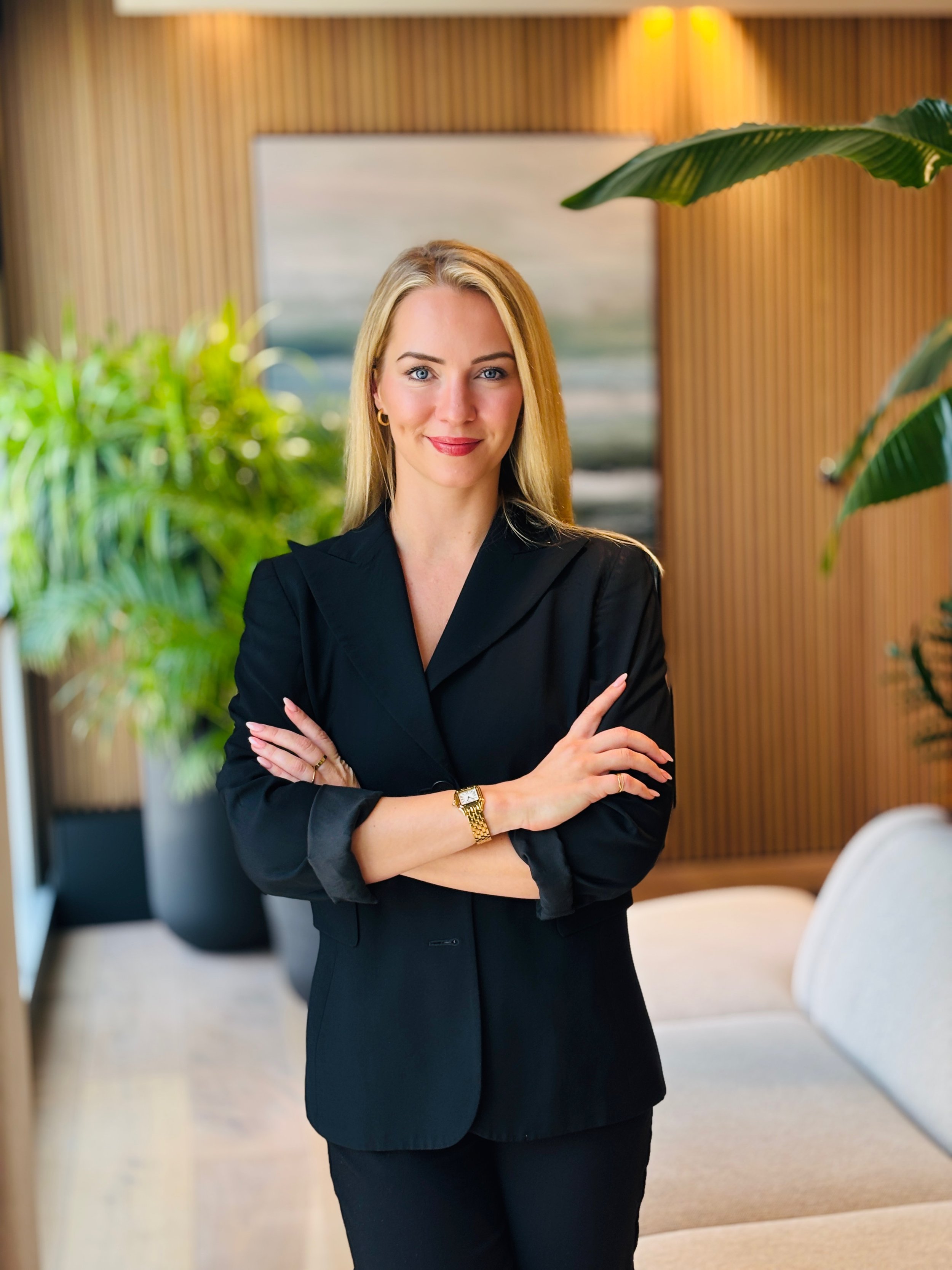 Professional headshot of a psychologist and corporate mental health speaker based in Dubai, UAE.