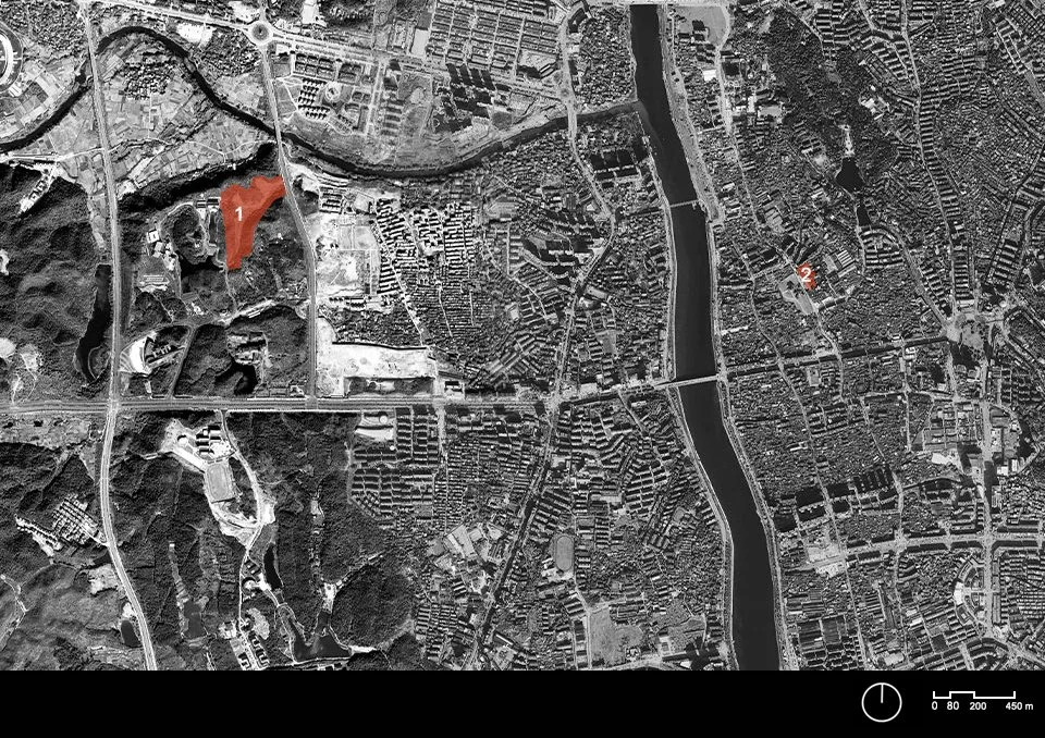 Satellite map showing an urban area with a river running through the center, surrounded by roads and buildings. Two locations are marked: one in the northwest and another on the east side of the river.
