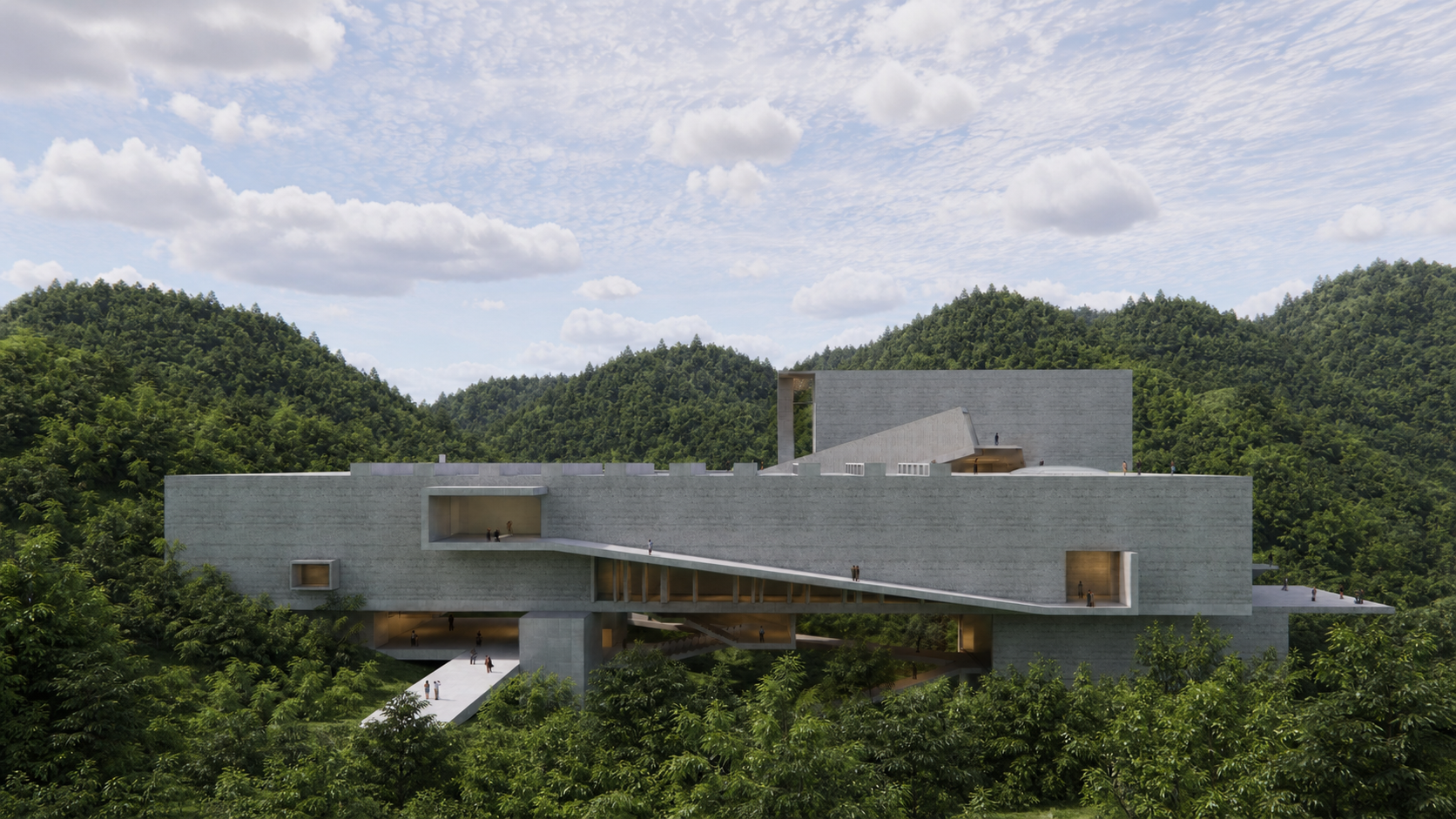 Modern concrete building with geometric shapes and platforms, surrounded by green forest and hills under a partly cloudy sky.