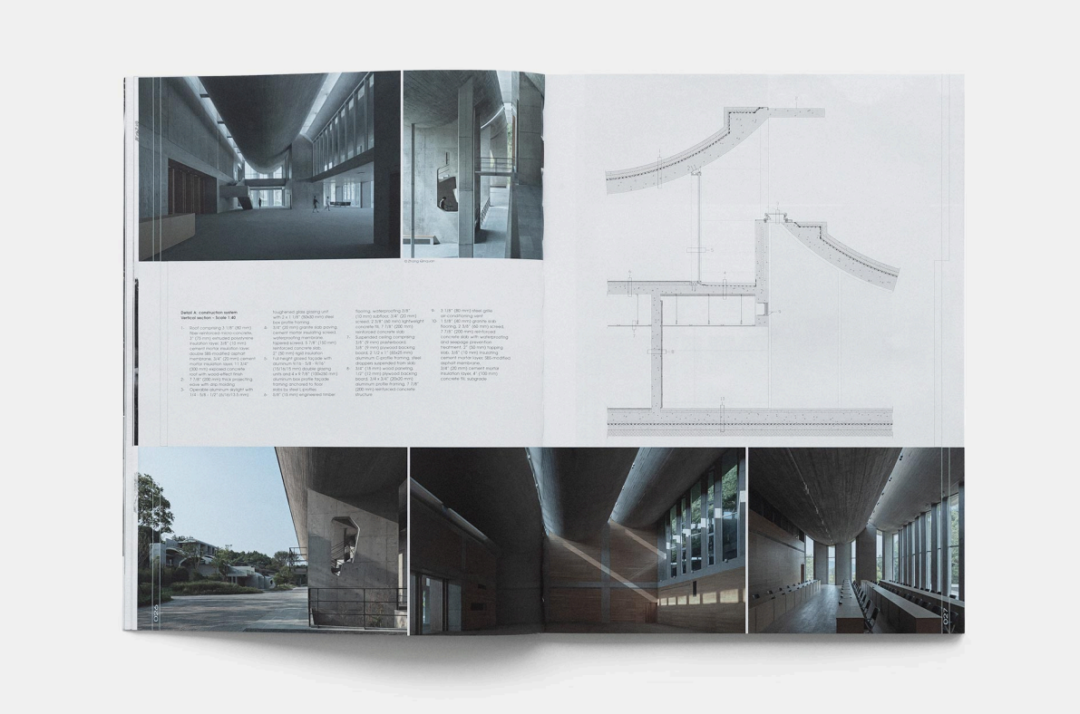 Open architectural design booklet showing interior and exterior photos, floor plans, and construction details of a modern building with large glass windows and concrete structures.