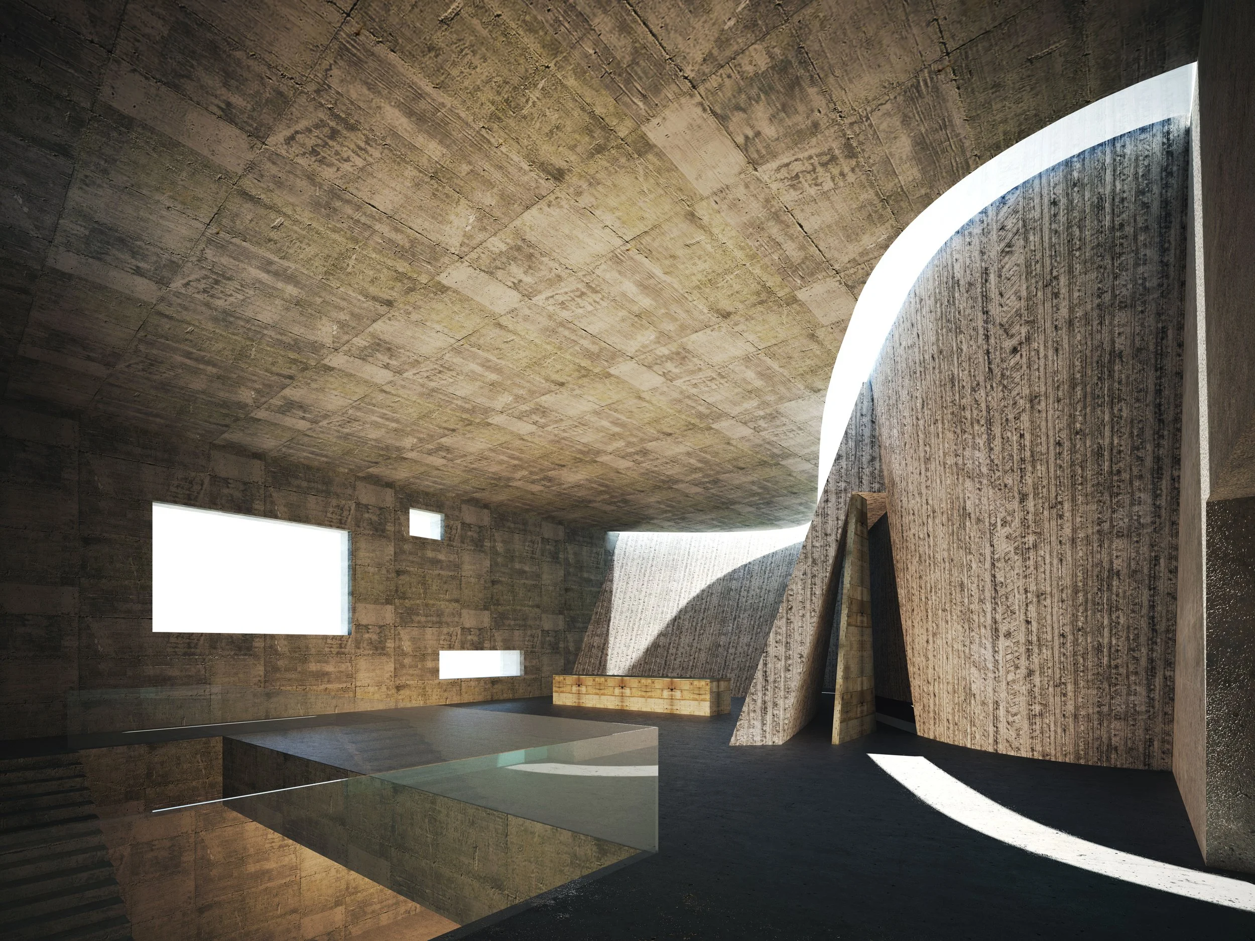 Interior of a modern architectural building with concrete walls, large open space, and curved design elements.