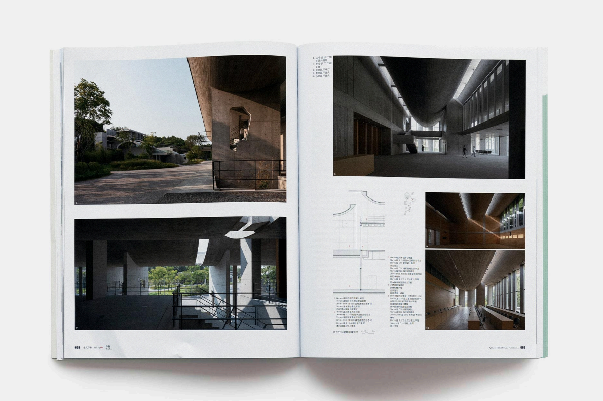 Open architecture magazine showing photographs and sketches of modern interior and exterior building designs with concrete structures and large windows.