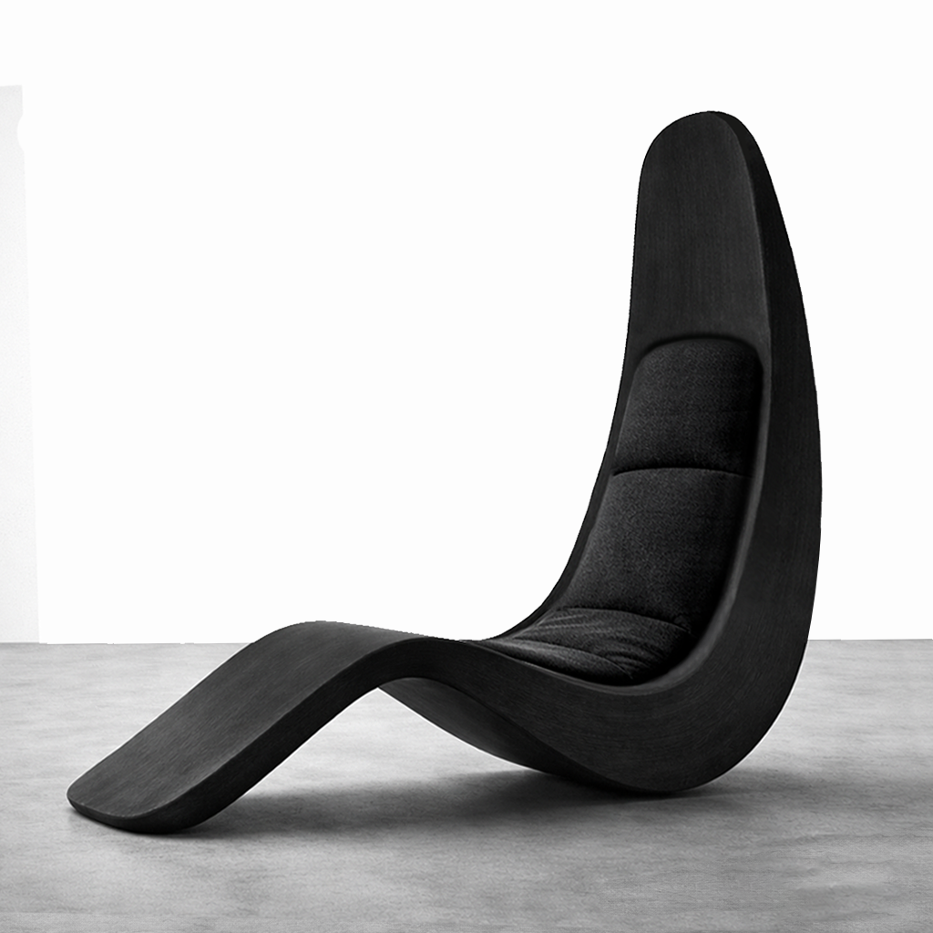 Modern black lounge chair with a high back and curved design, placed on a concrete floor against a white wall.