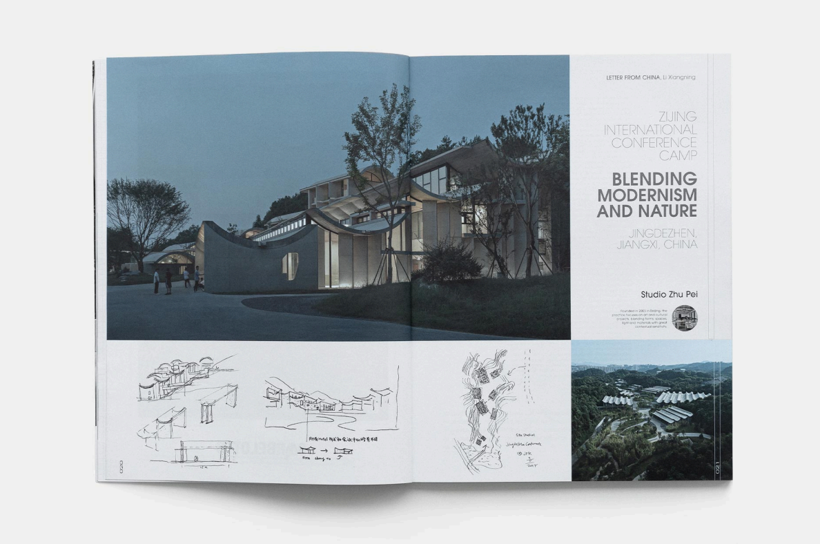 Open magazine featuring a night-time architectural photo of modern buildings in Jingdezhen, Jiangxi, China, with sketches and a landscape photo on the pages.