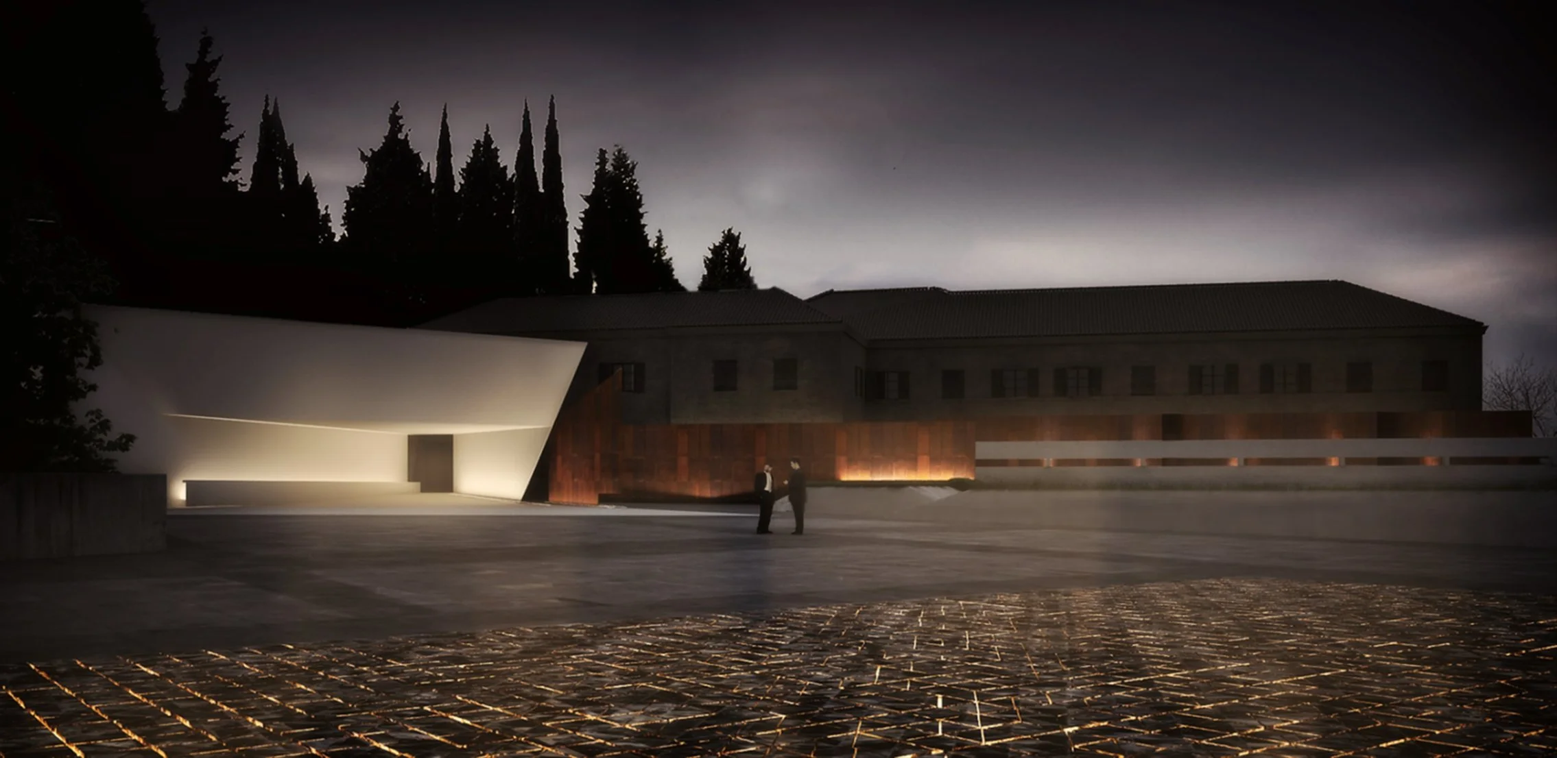 Nighttime view of a modern building with unique white and rust-colored architectural elements, two people in formal attire talking, and trees in the background under a dark sky.