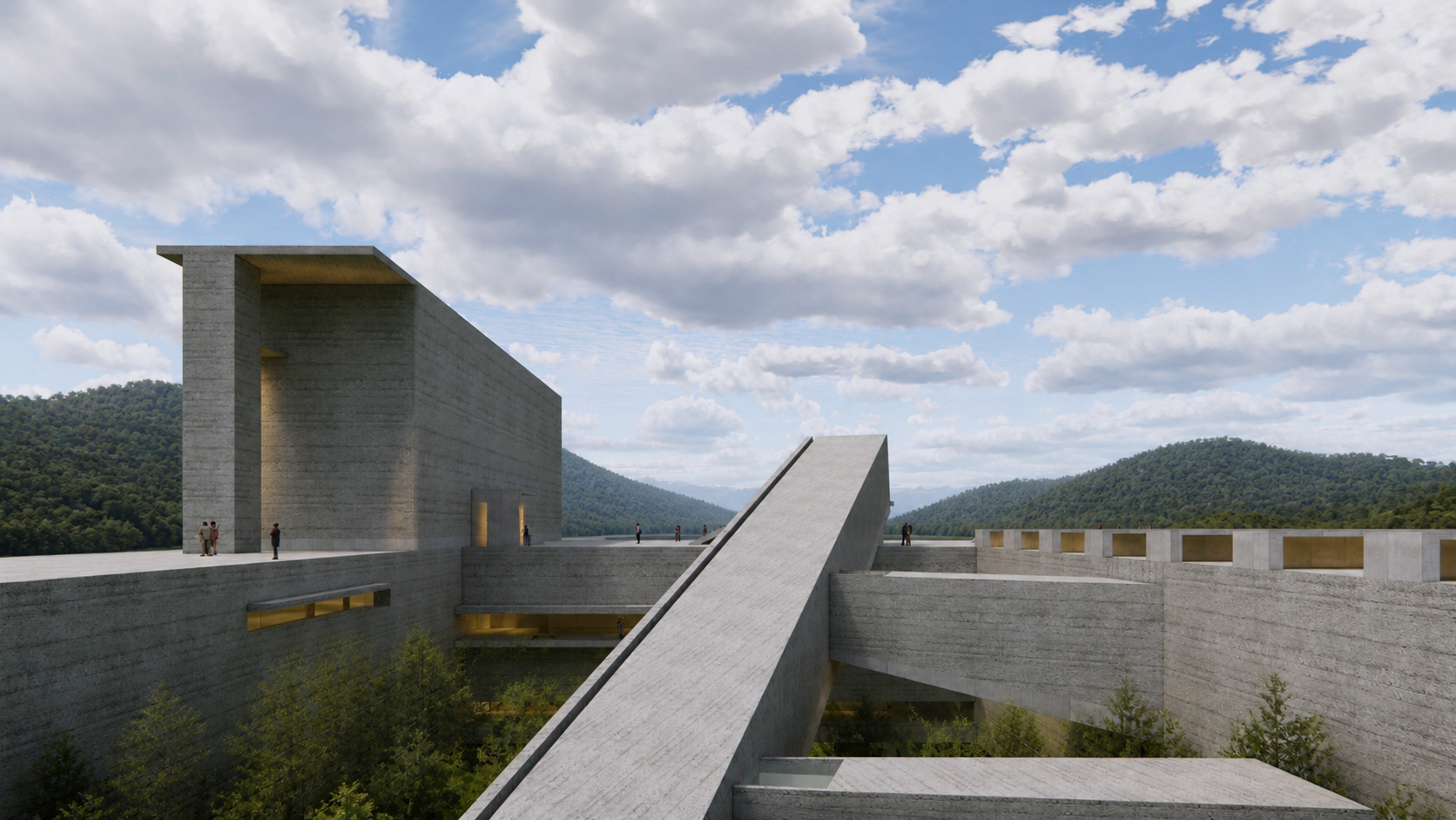 A modern concrete architectural structure with large blocks and sloped walkways set against a backdrop of green mountains and a partly cloudy sky.