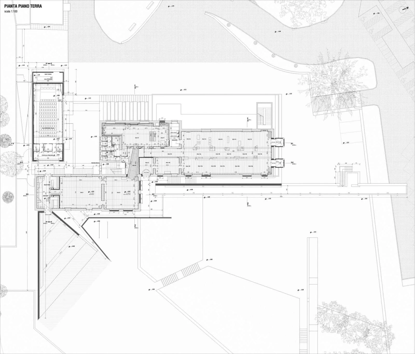 Architectural blueprint of a building's ground floor plan, showing rooms, walls, doors, and outdoor landscape elements.
