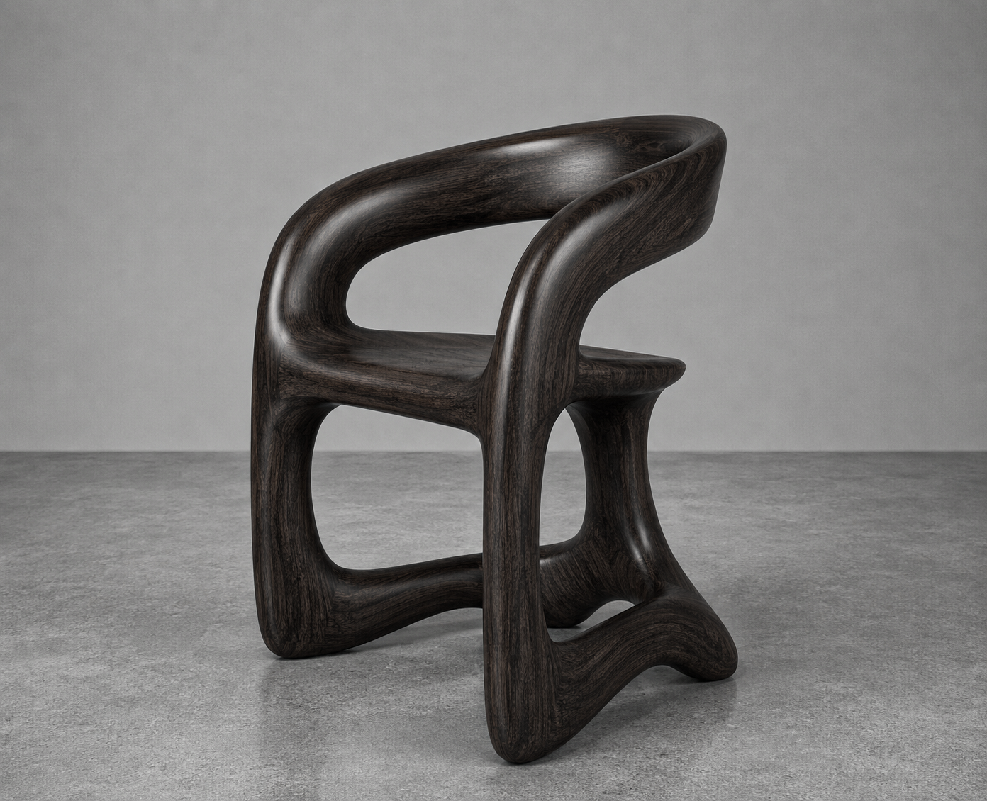 Dark wooden modern chair with bold, curved design on a gray concrete floor and light gray wall background.