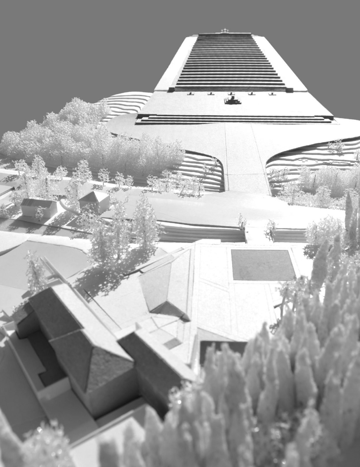 Architectural model of a large stepped building with trees and smaller structures in the foreground.