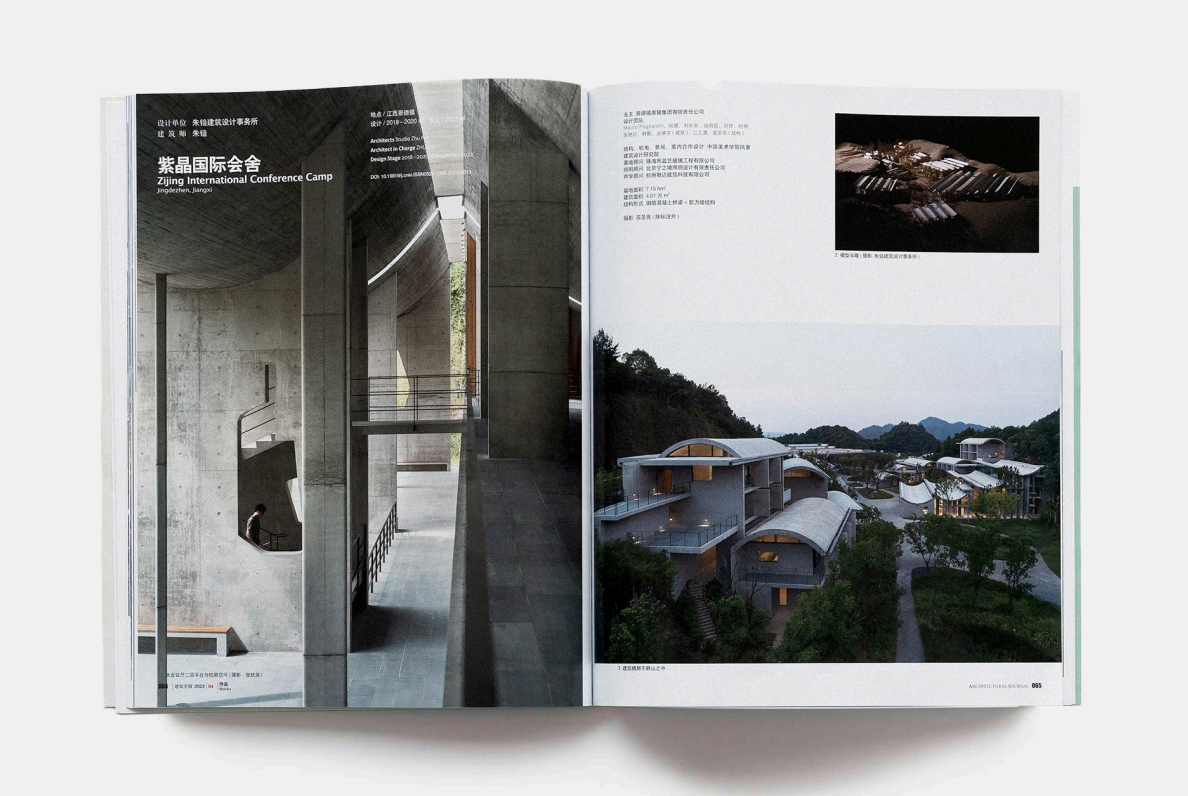 An open magazine featuring architectural designs, with images of modern concrete structures and a landscape of contemporary buildings surrounded by greenery.