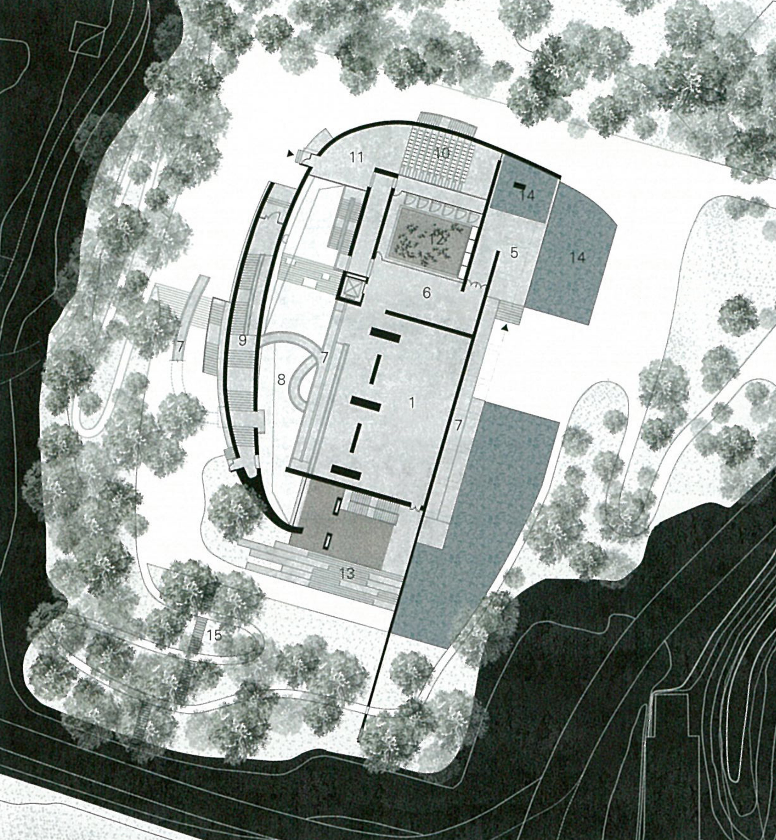 Architectural site plan showing a building surrounded by trees and landscaped areas, with numbered sections and boundary lines.